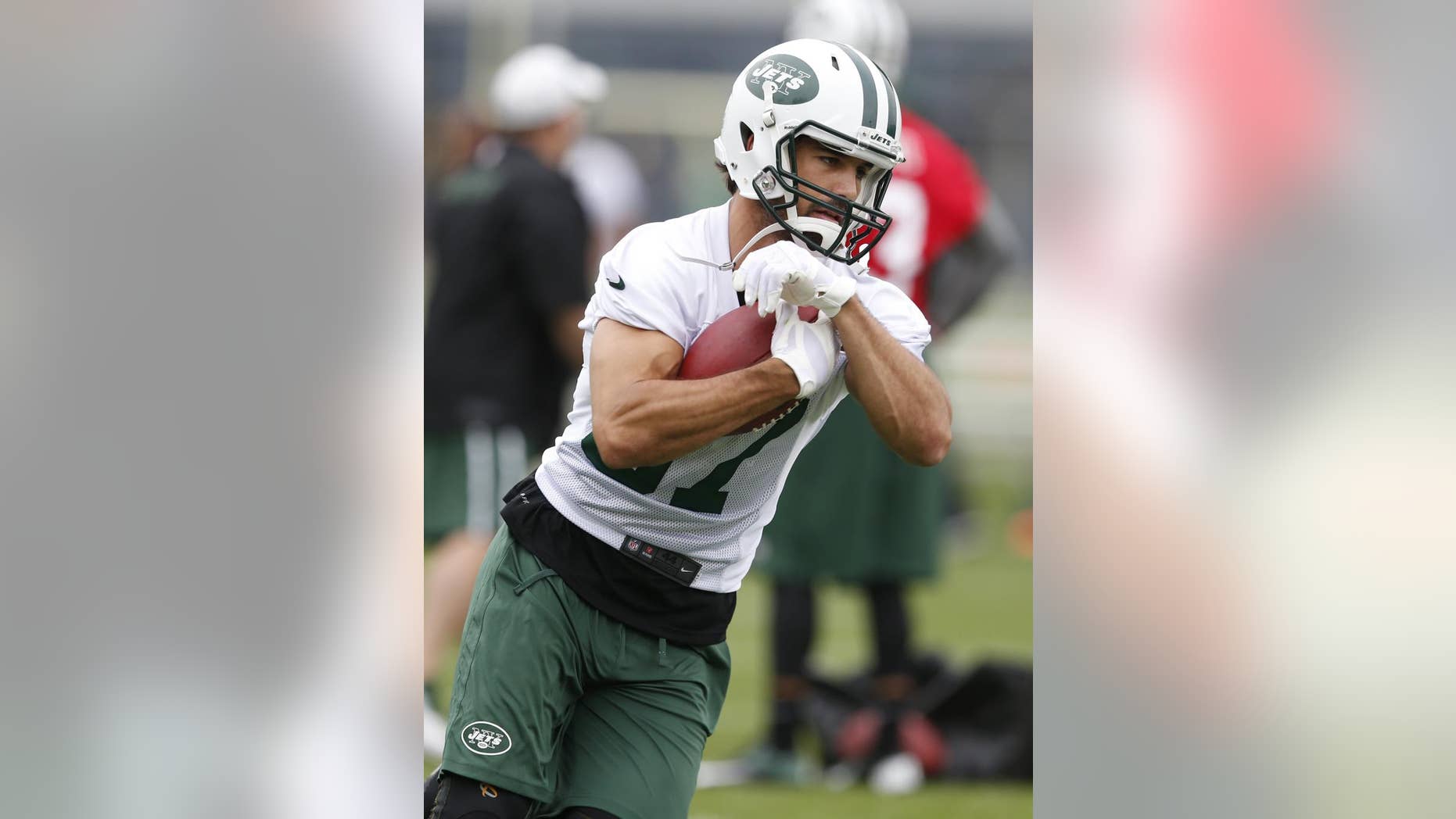 FILE - In this May 28, 2014, file photo, New York Jets wide receiver Eric Decker runs with the ball during an NFL football organized team activity in Florham Park, N.J. The Jets went into the offseason needing to upgrade their receiving corps in a big way. Now, they all need to mesh in Marty Mornhinweg's offense. (AP Photo/Julio Cortez, File)