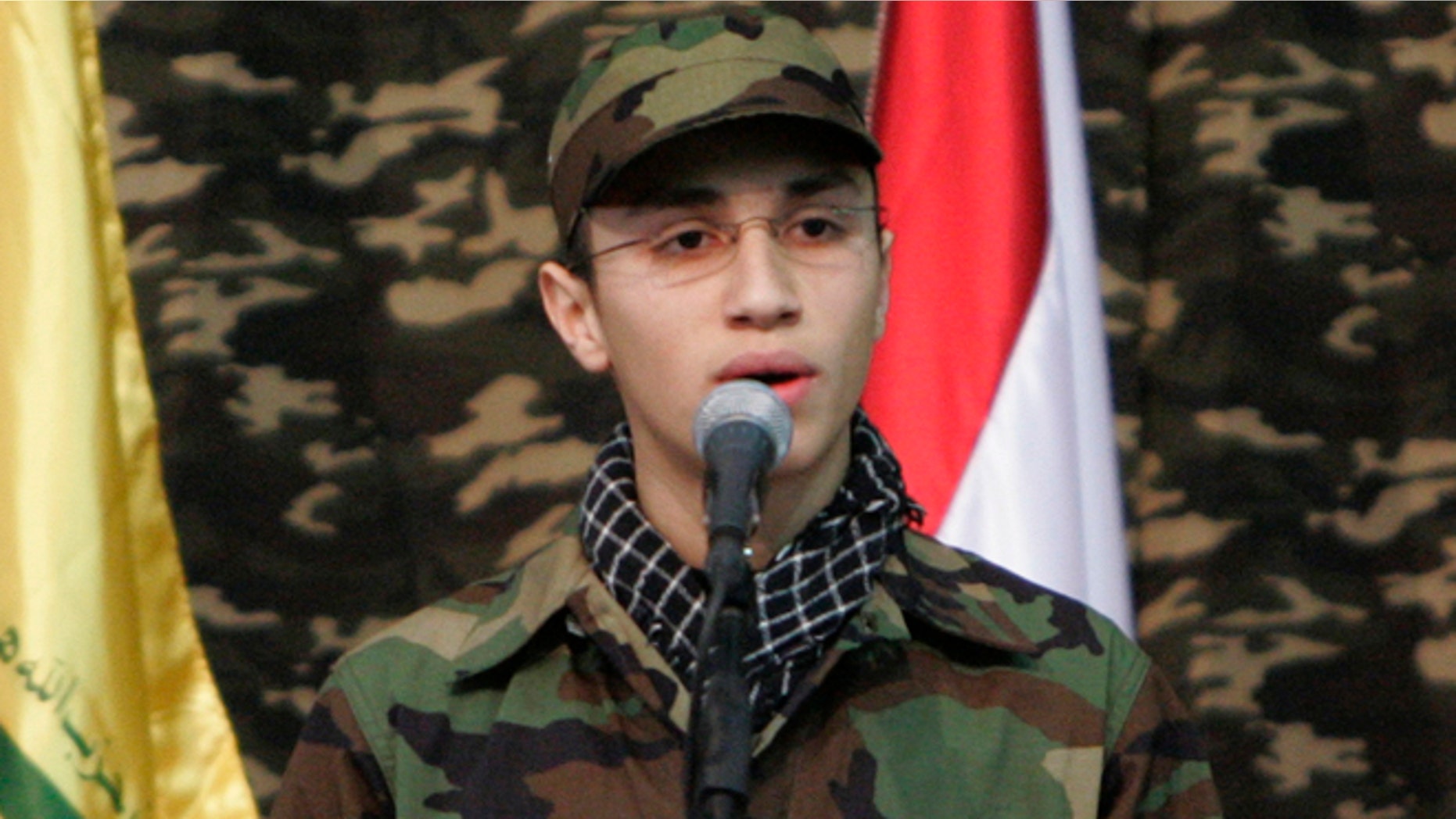 Feb. 22, 2008: Jihad Mughniyeh, the son of slain top Hezbollah commander Imad Mughniyeh, speaks during a rally to commemorate his father and two other leaders Abbas Musawi and Ragheb Harb, in the Shiite suburb of Beirut, Lebanon. A Hezbollah official said Sunday, Jan. 18, 2015, that an Israeli strike in the Syrian Golan Heights killed Jihad Mughniyeh and four other fighters from the Lebanese Shiite militant group.