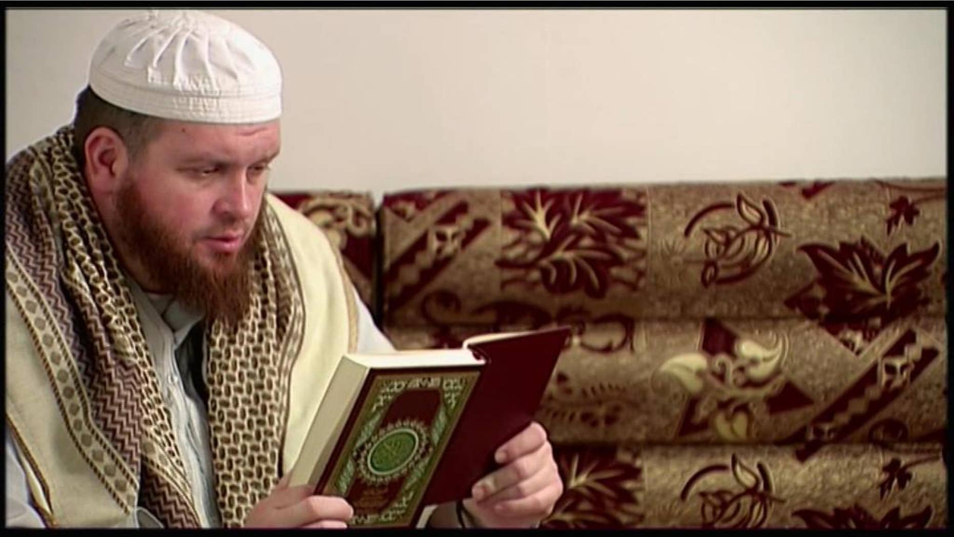 This image provided by New Zealand 3 News/MediaWorks via APTN shows Mark Taylor, who converted to Islam and is now thought to be in Syria, as he reads the Quran in his native New Zealand. Taylor, 42, began visiting a mosque in the city of Hamilton some years ago, and resurfaced 2014 in Syria. Authorities estimate only a half-dozen New Zealanders have traveled to Syria to fight with the Islamic State group. It’s unclear how they’ve become radicalized, although Taylor’s case might provide a clue: He’s acknowledged listening to the sermons of the late U.S.-born al-Qaida preacher Anwar al-Awlaki. (New Zealand 3 News/MediaWorks via APTN) AUSTRALIA OUT; NEW ZEALAND OUT
