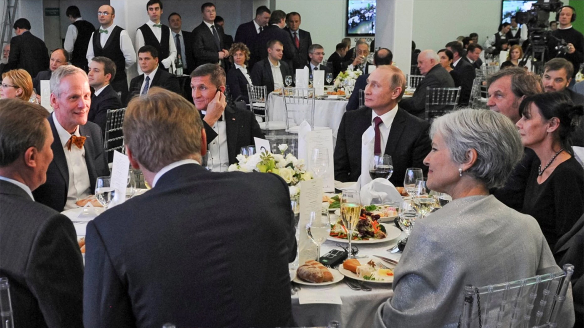 Russian President Vladimir Putin, center right, with retired U.S. Lt. Gen. Michael T. Flynn, center left, and former Green Party presidential candidate Jill Stein, front right, attend a 2015 dinner in Moscow.