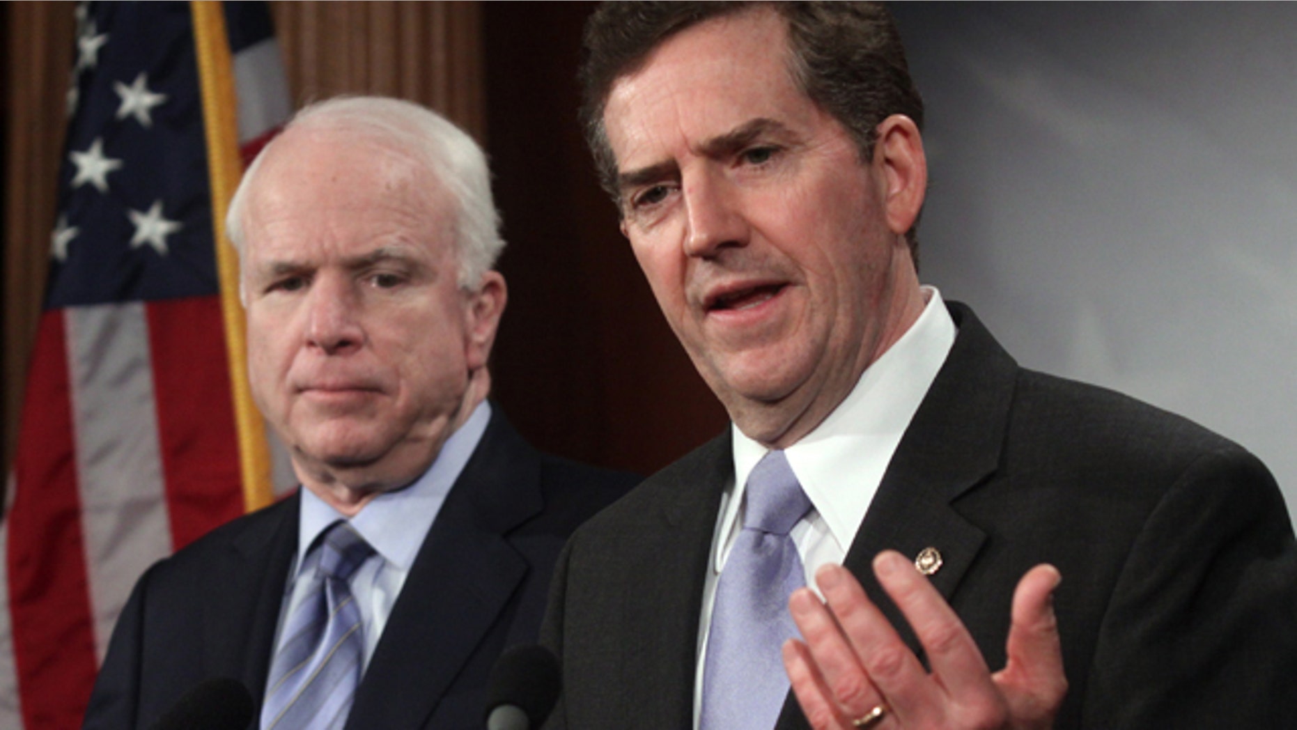 Feb. 4, 2010: Sen. Jim DeMint, R-S.C., right, attends a news conference with John McCain on Capitol Hill in Washington.