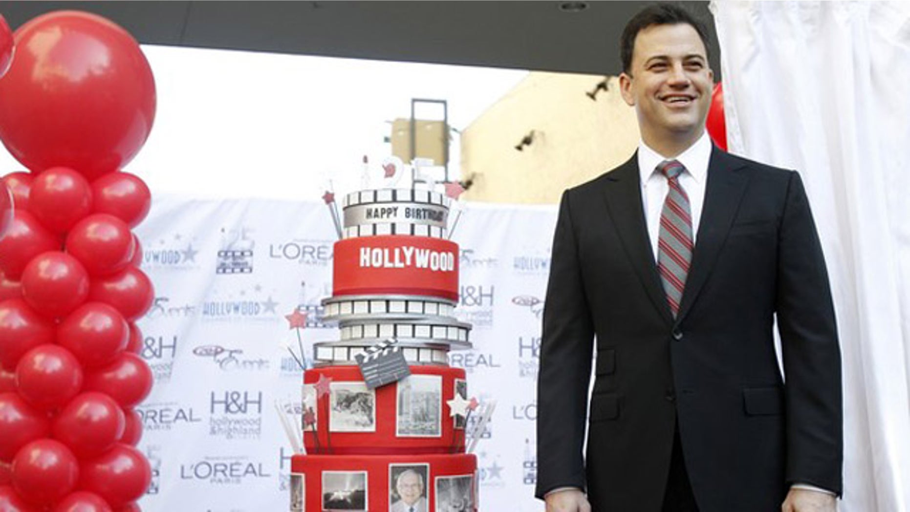 Feb. 1, 2012: Television host Jimmy Kimmel poses next to a cake during a celebration for the 125th anniversary of the City of Hollywood in Hollywood, California.