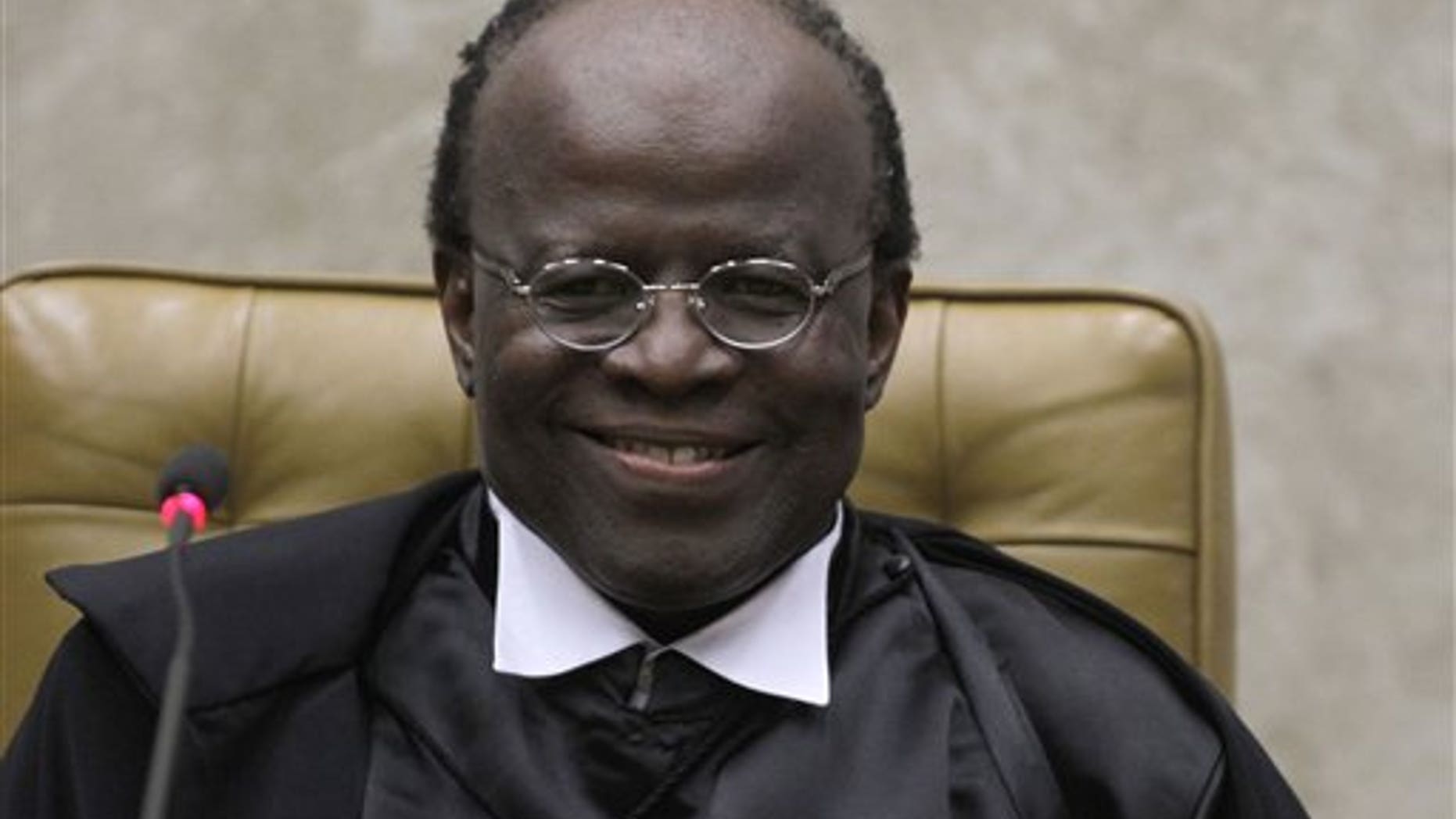 Joaquim Barbosa smiles during his inauguration ceremony at the Supreme Court in Brasilia, Brazil.
