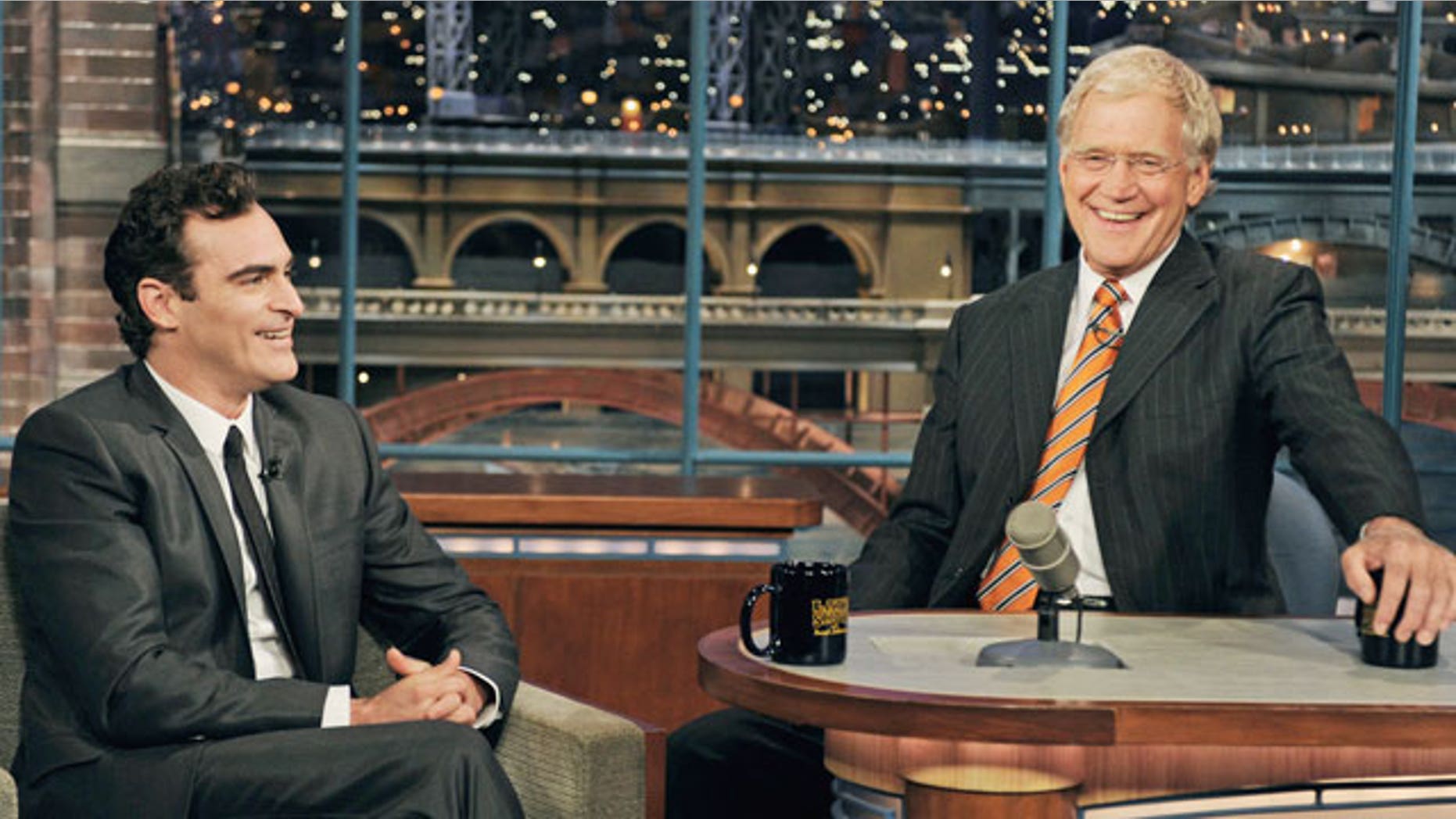Sept. 22: In this photo released by CBS, actor Joaquin Phoenix, left, gestures to host David Letterman on the set of the "Late Show with David Letterman."