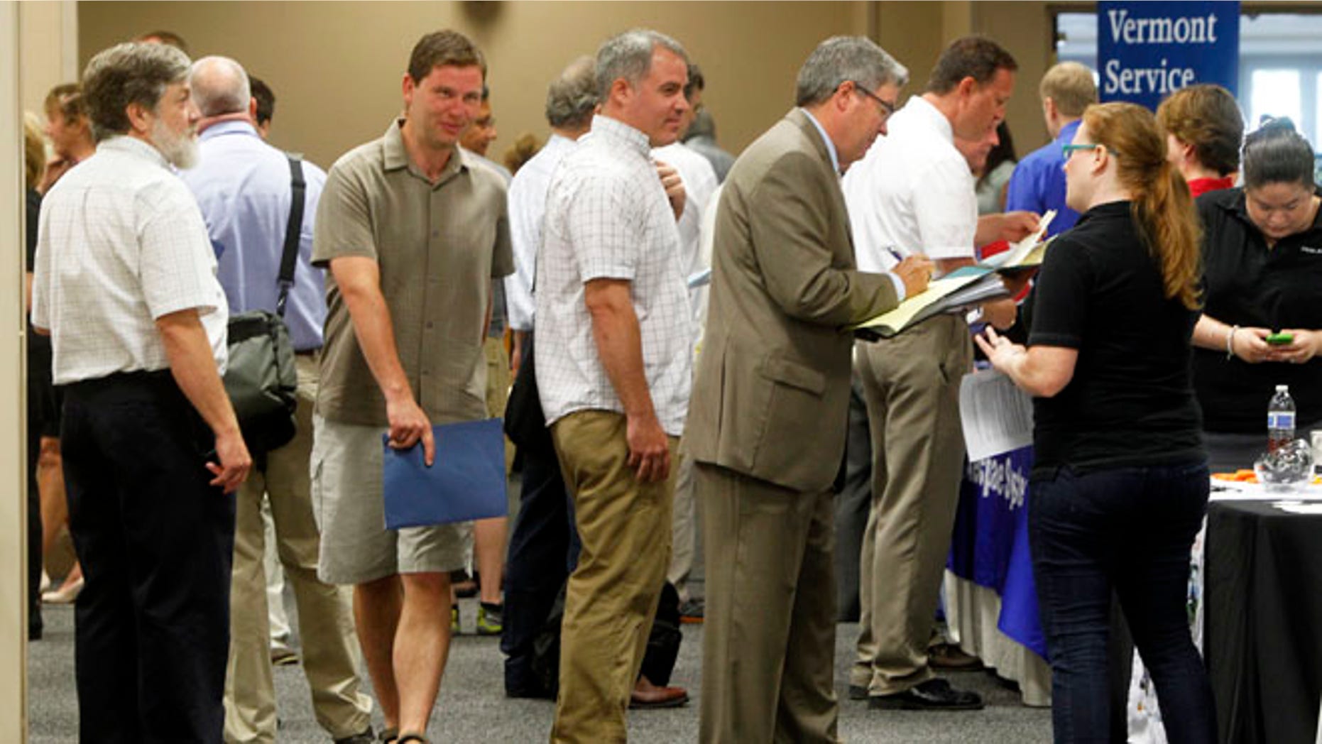 People line up at the job fair in South Burlington, Vt. A disproportionate number of the added jobs were part-time or low-paying, or both. Part-time work accounted for more than 65 percent of the positions employers added in July.