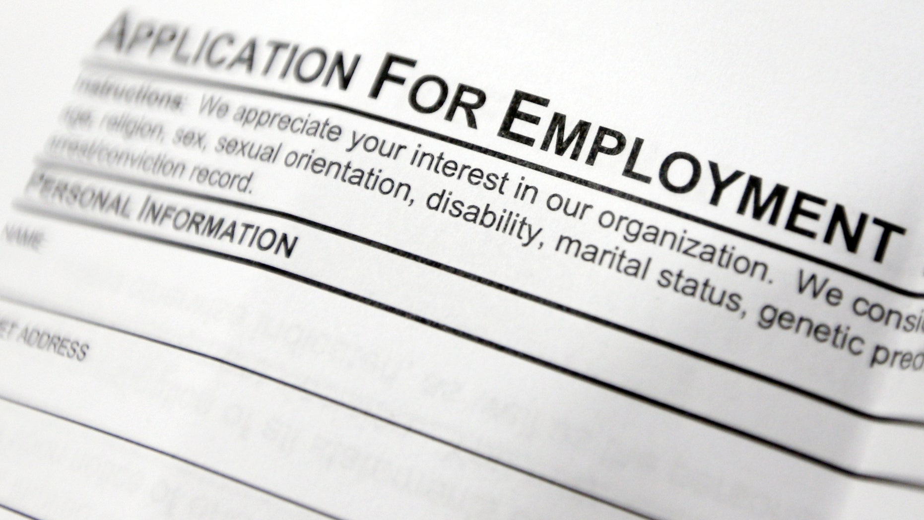 FILE - This April 22, 2014, file photo shows an employment application form on a table during a job fair at Columbia-Greene Community College in Hudson, N.Y. The Labor Department reports on job openings and labor turnover in June 2014 on Tuesday, Aug. 12, 2014. (AP Photo/Mike Groll, File)