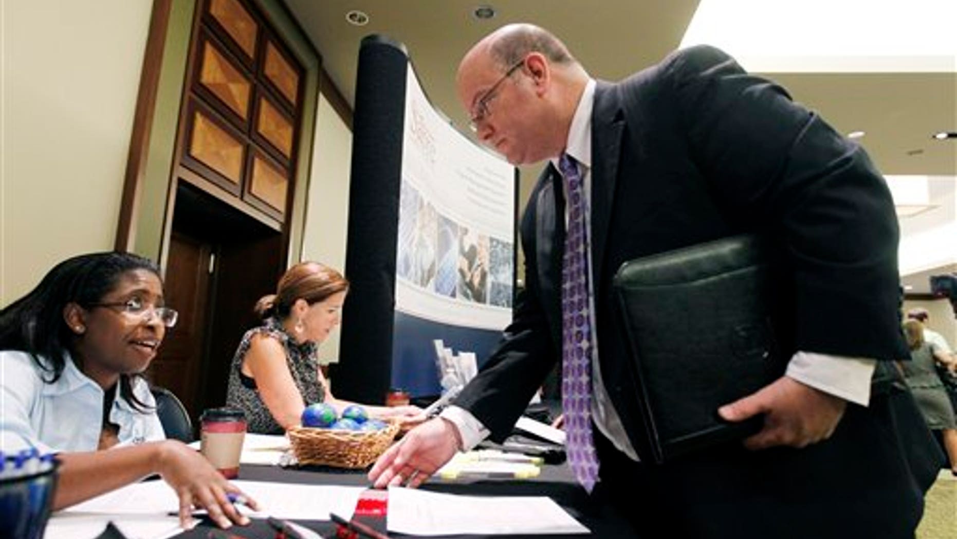August 4: Job seeker during a Career Job Fair in Arlington, Va.