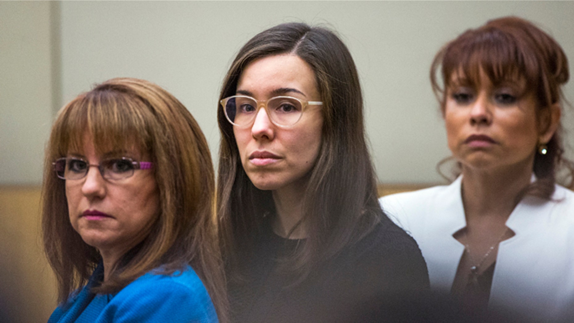 FILE - Convicted murderer Jodi Arias, center, watches the jury enter the courtroom before hearing their verdict in this March 5, 2015 file photo taken in Maricopa County Superior Court in Phoenix. A court document released Tuesday March 10, 2015 by the judge in the case reveals the behind-the-scenes wrangling in the jury room as Arias' fate hung in the balance. (AP Photo/The Arizona Republic, Tom Tingle, Pool, File)