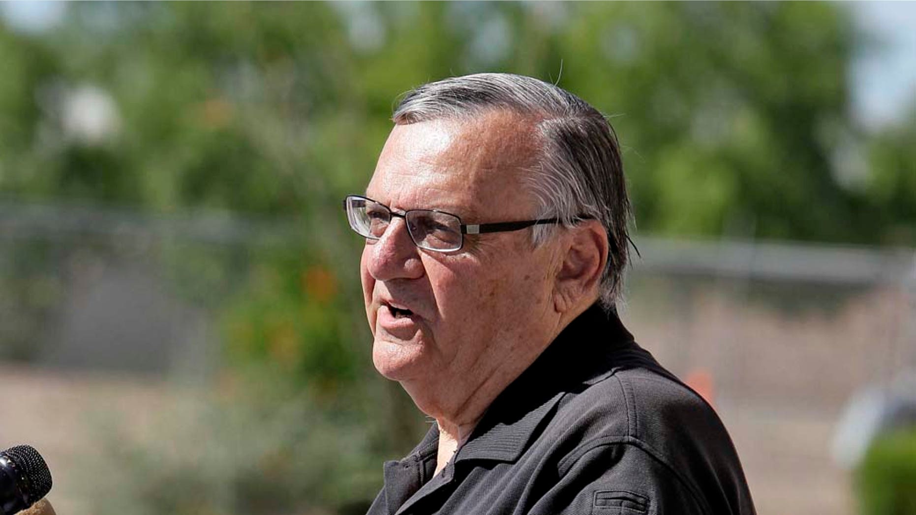 Maricopa County Sheriff Joe Arpaio, showcasing 2,300 lbs of seized marijuana, speaks to the media Thursday, May 12 2011 outside the Sheriff's training center in Phoenix. Sheriff Arpaio confirms two agents were killed in a freight train collision. And he says the FBI will be taking over the investigation. (AP Photo/Matt York)