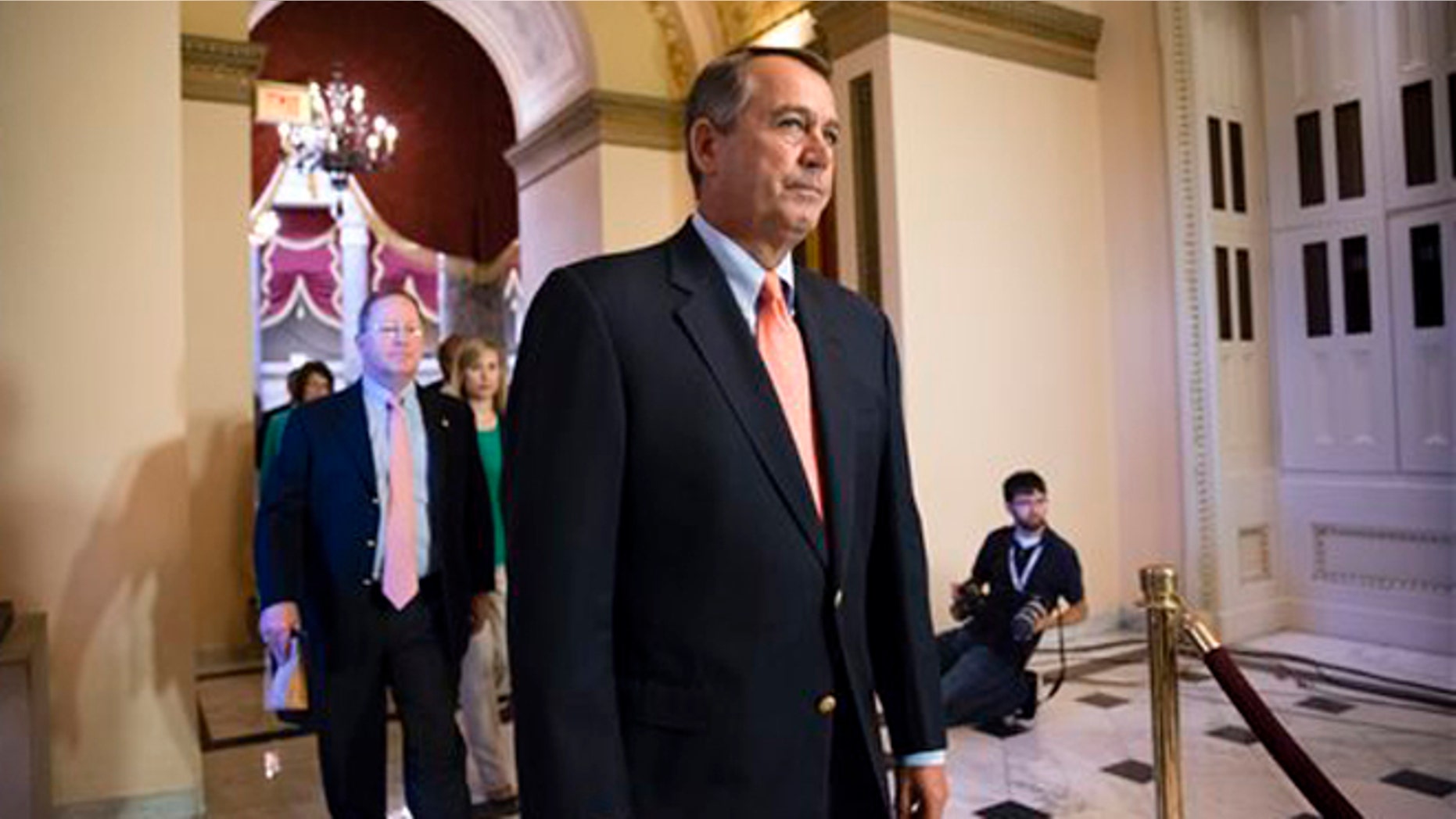 FILE: Oct. 5, 2013: House Speaker John Boehner walks to the chamber as lawmakers vote to pay furloughed federal workers, at the Capitol in Washington, D.C.