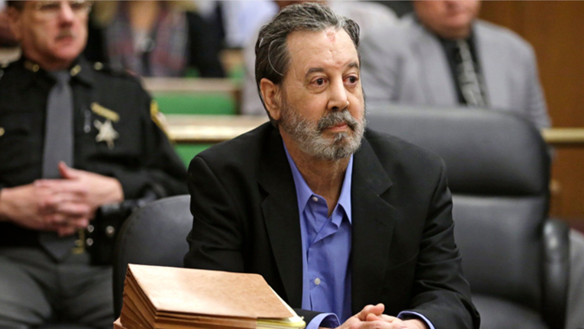 Nov. 14, 2013: This photo shows Bobby Thompson, who authorities have identified as Harvard-trained attorney John Donald Cody, sitting in the courtroom waiting for the verdict in Cleveland. Thompson, convicted in Cleveland of masterminding a $100 million, cross-country Navy veterans charity fraud, faces sentencing Monday. The Ohio attorney general's office handled his trial and has asked the judge for a 41-year sentence and $6 million fin