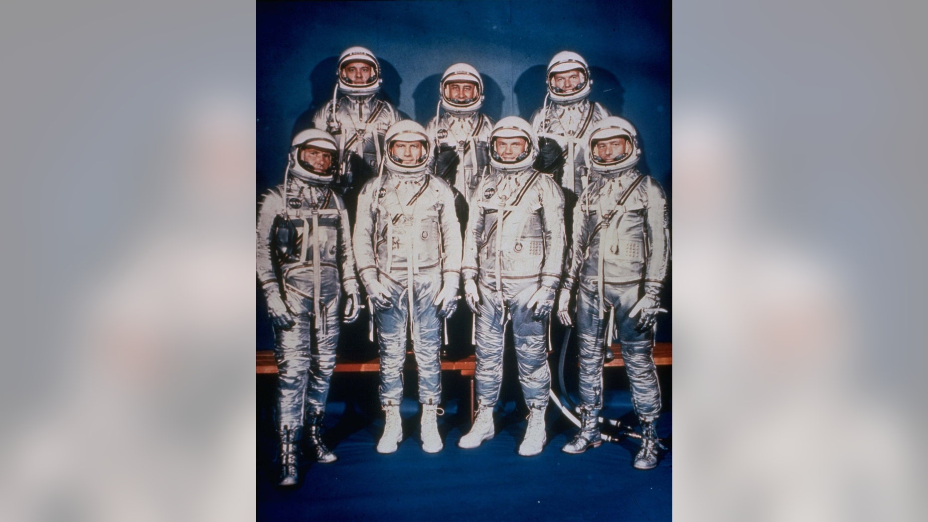 This 1961 file photo provided by NASA shows the original seven Mercury astronauts in their silver spacesuits. First row, from left are Walter Schirra Jr., Donald Slayton, John Glenn and Scott Carpenter. In the back row are Alan Shepard, Jr., Virgil Grissom and Gordon Cooper.