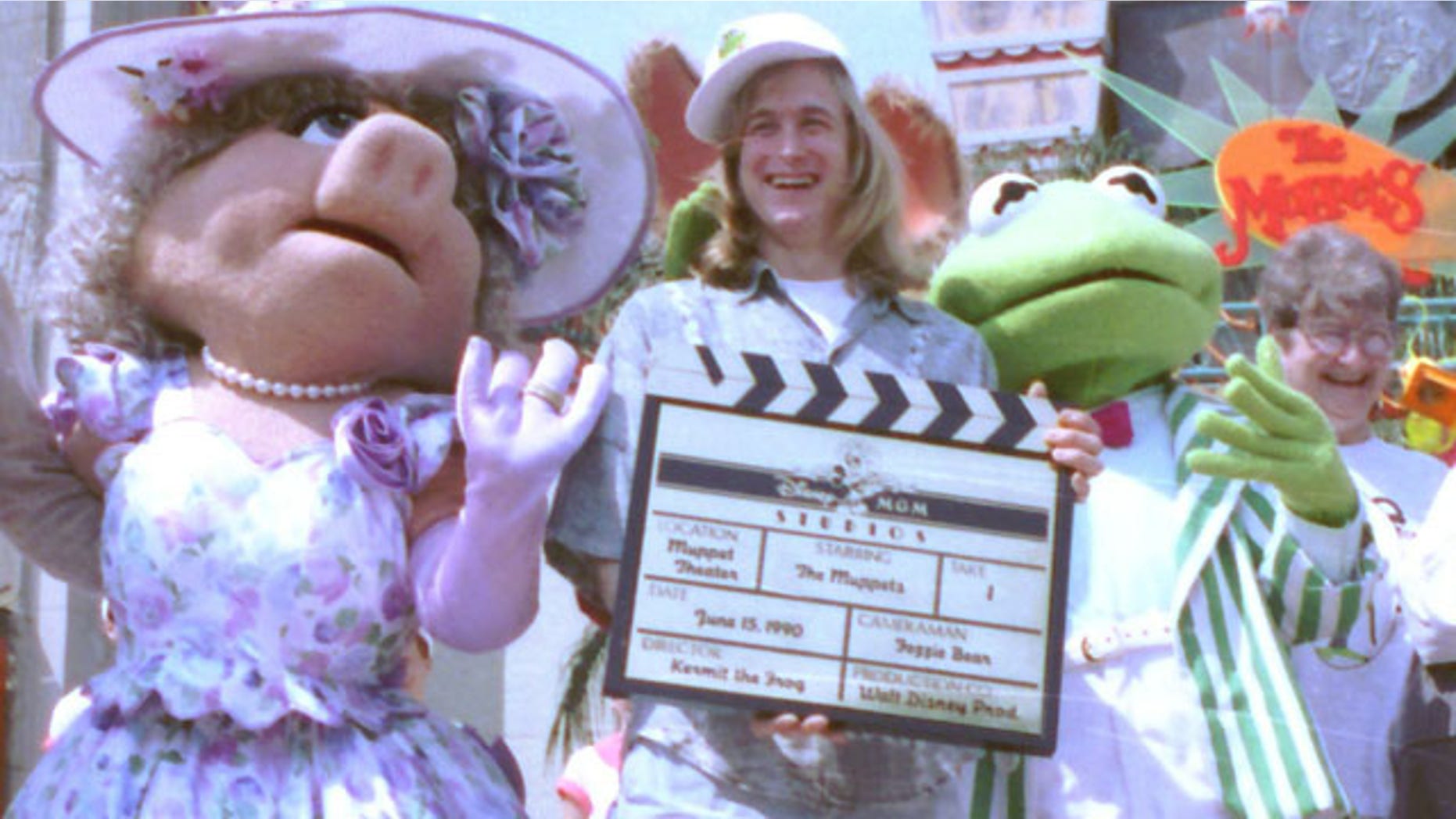 FILE - Puppeteer John Henson, the son of the late Muppets creator Jim Henson is seen with Muppets Miss Piggy and Kermit at the Disney/MGM studios in Lake Buena Vista, Florida in this June 15, 1990 file photo. Cheryl Henson says her brother died of a "massive heart attack" died at his home in Saugerties, New York on Friday Feb. 14, 2014. He was 48. (AP Photo/FILE)