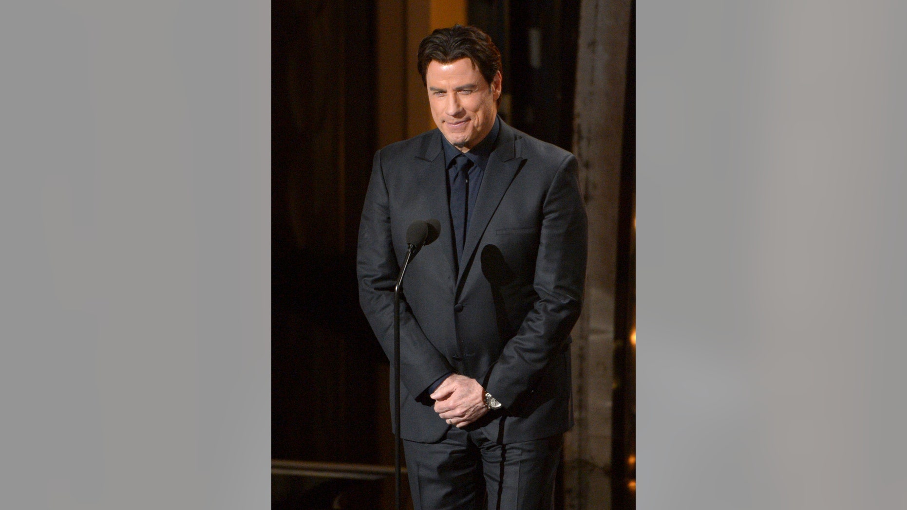 Presenter John Travolta speaks during the Oscars at the Dolby Theatre on Sunday, March 2, 2014, in Los Angeles. (Photo by John Shearer/Invision/AP)