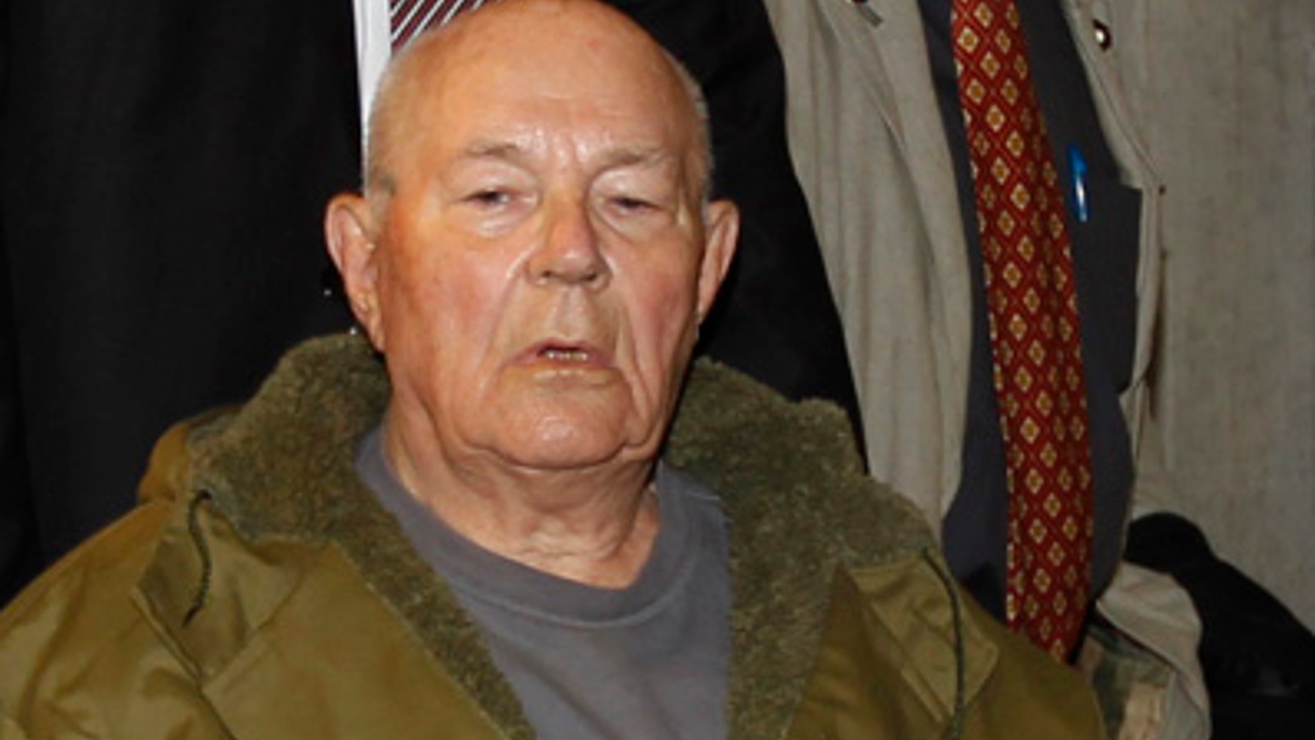 In this Thursday, May 12, 2011 file photo, John Demjanjuk leaves a courtroom in Munich. German police say sentenced Nazi criminal John Demjanjuk died Saturday March 17, 2012 at a home for the elderly in southern Germany where he has stayed since his trial ended in Munich last year.
