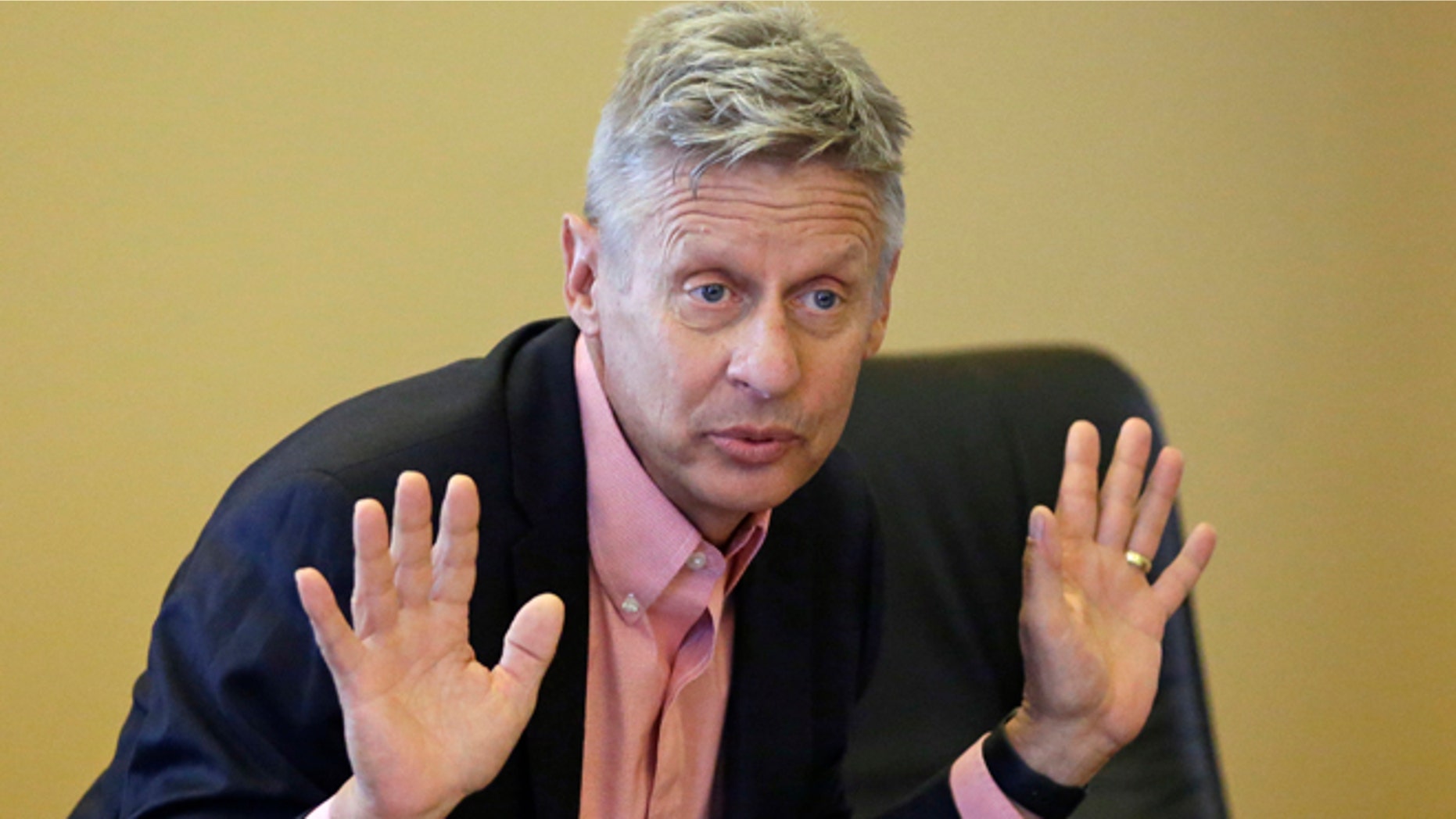 FILE - In this May 18, 2016 file photo, Libertarian presidential candidate, former New Mexico Gov. Gary Johnson speak with legislators at the Utah State Capitol in Salt Lake City. Utah Republicans, mostly Mormons, are now struggling to figure out how to cast their vote this November. Donald Trump has shattered the normal Republican consensus in Utah even more so than he has nationwide, activating fault lines under a normally stable electorate largely unified by a single religion. (AP Photo/Rick Bowmer, File)