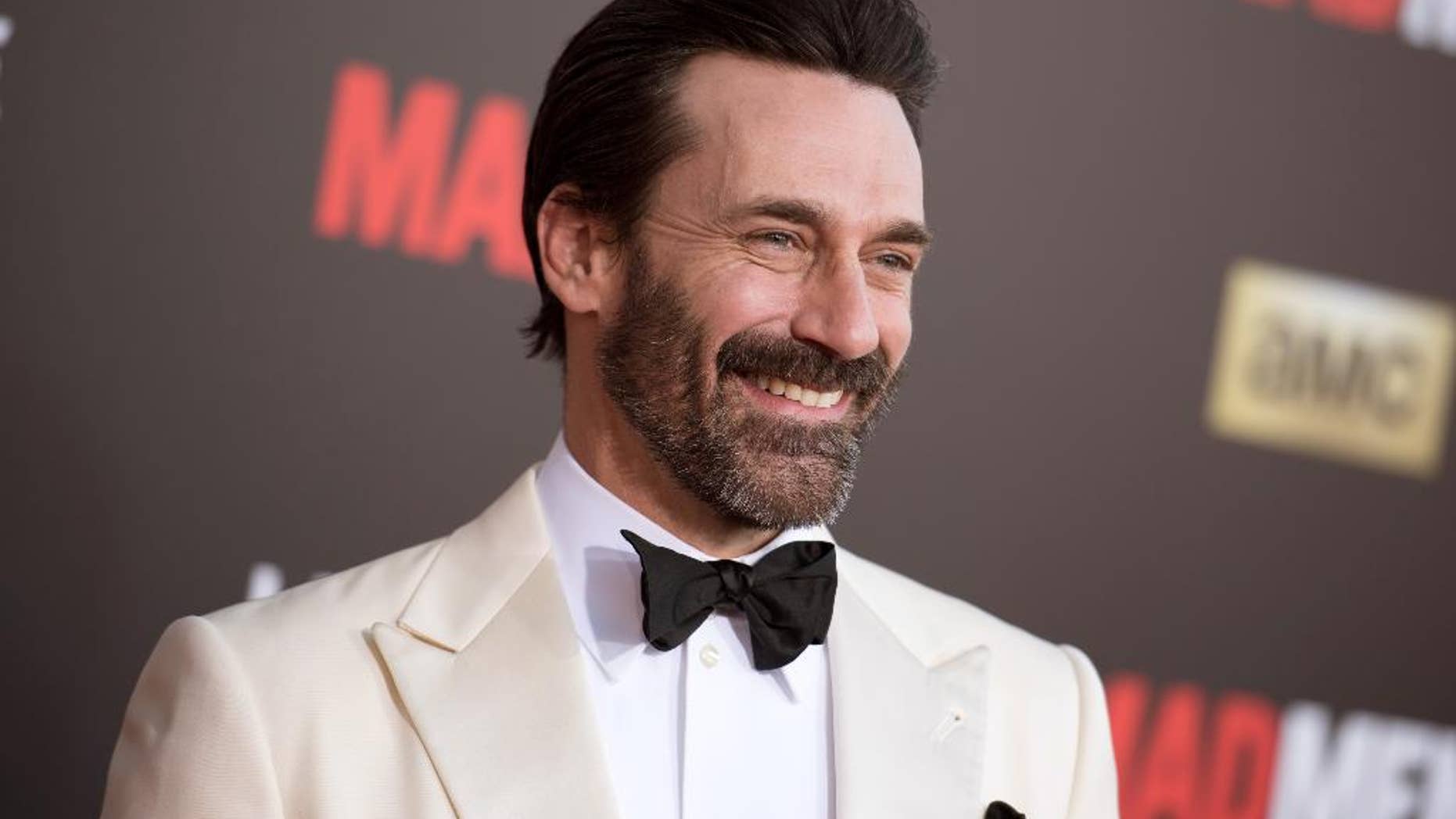 FILE - In this March 25, 2015 file photo, Jon Hamm arrives at The Black And Red Ball In Celebration Of The Final Seven Episodes Of "Mad Men" in Los Angeles. Court records show “Mad Men” star Jon Hamm was accused of helping lead a violent 1990 fraternity hazing at the University of Texas. (AP Photo/Photo by Richard Shotwell/Invision/AP, File)