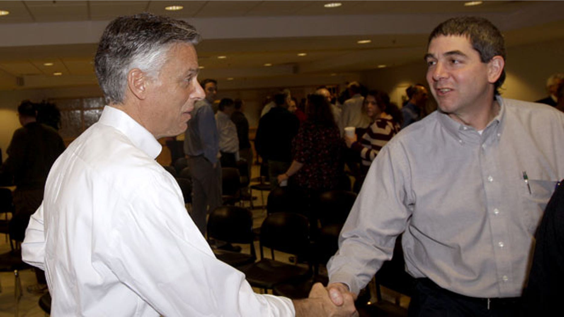 January 5, 2012: Republican presidential candidate, former Utah Gov. Jon Huntsman shakes the hand of an employee after a town hall style meeting at Goss International in Durham, N.H.