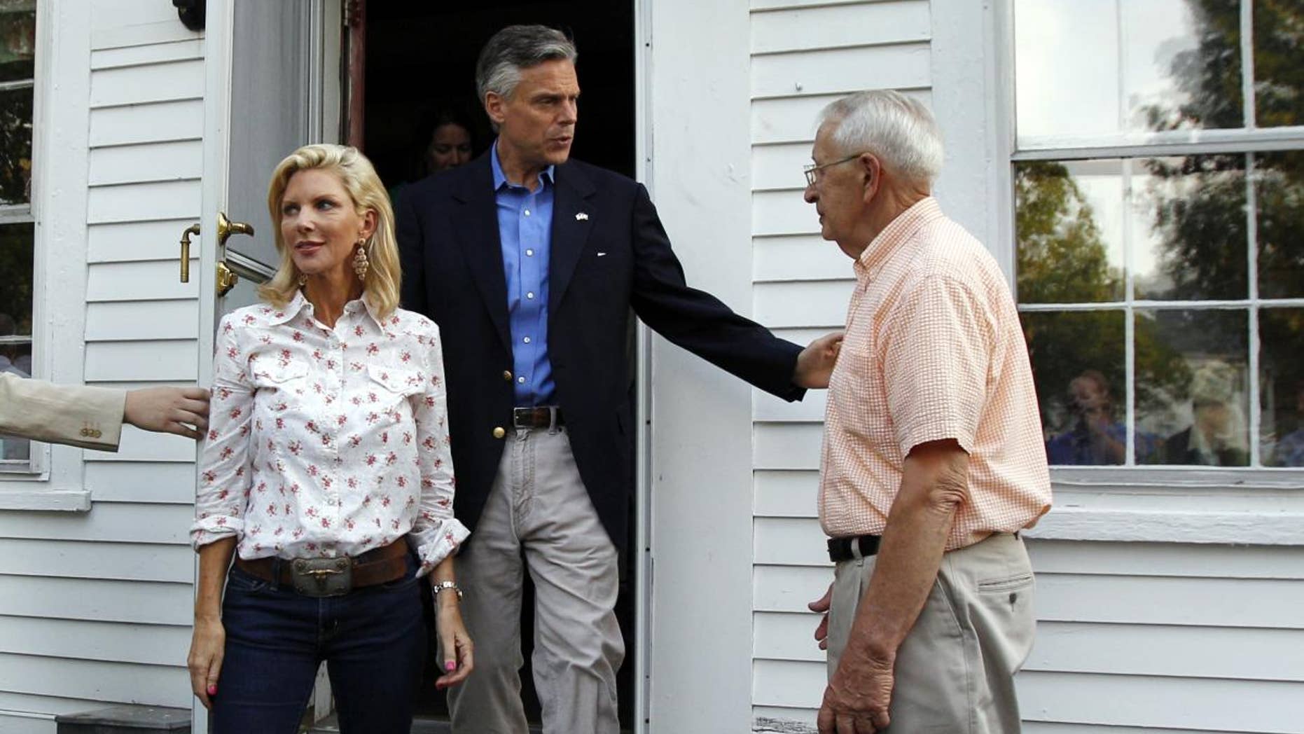Likely 2012 presidential hopeful, former Republican Gov. Jon Huntsman, Jr., of Utah, and his wife, Mary Kaye, left, leave the home of Wally Stickney, right, after a gathering in Salem, N.H. Friday, June 10, 2011. (AP Photo/Elise Amendola)