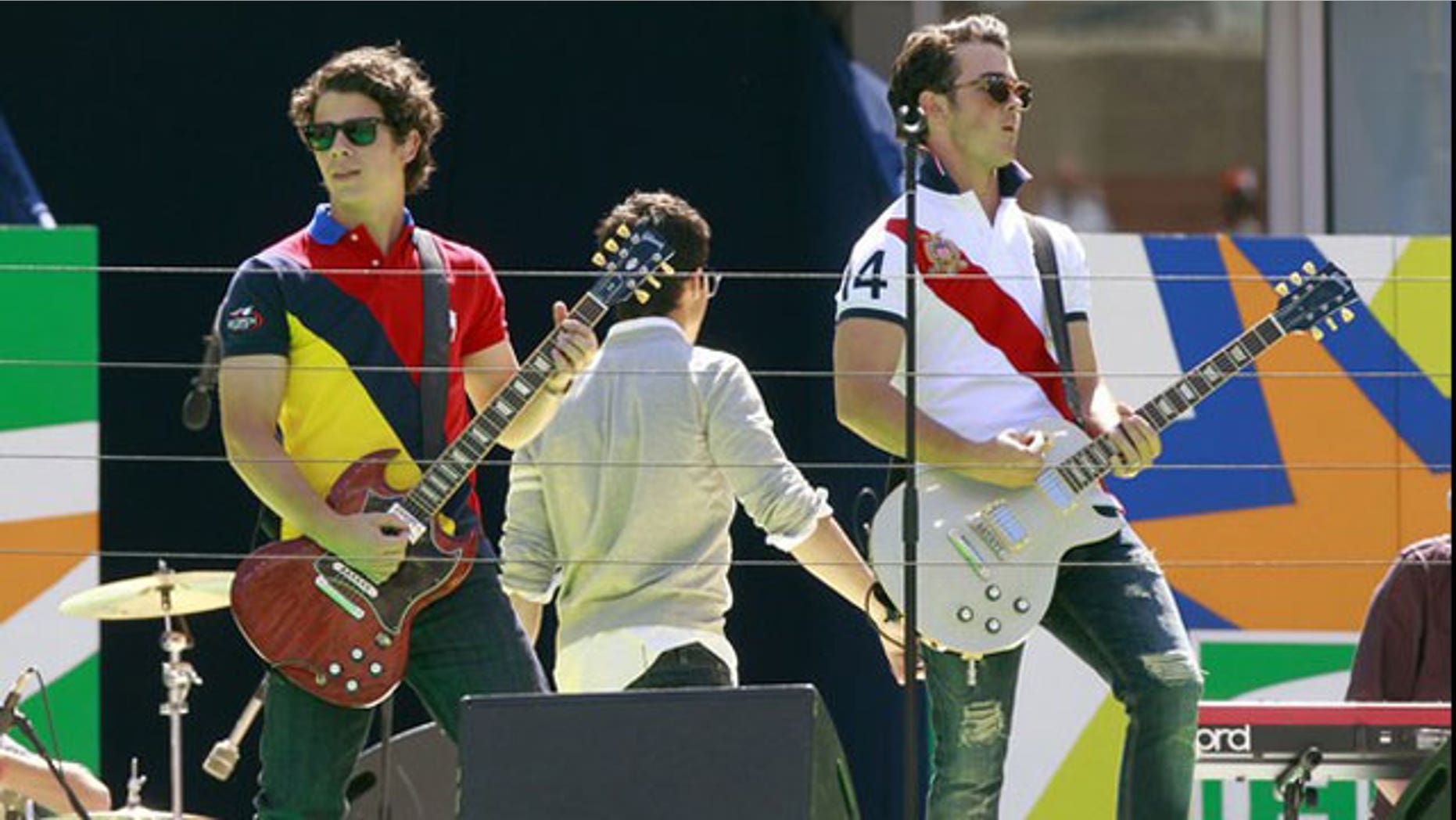 The Jonas Brothers perform. Their manager is launching a web search for the next big star.