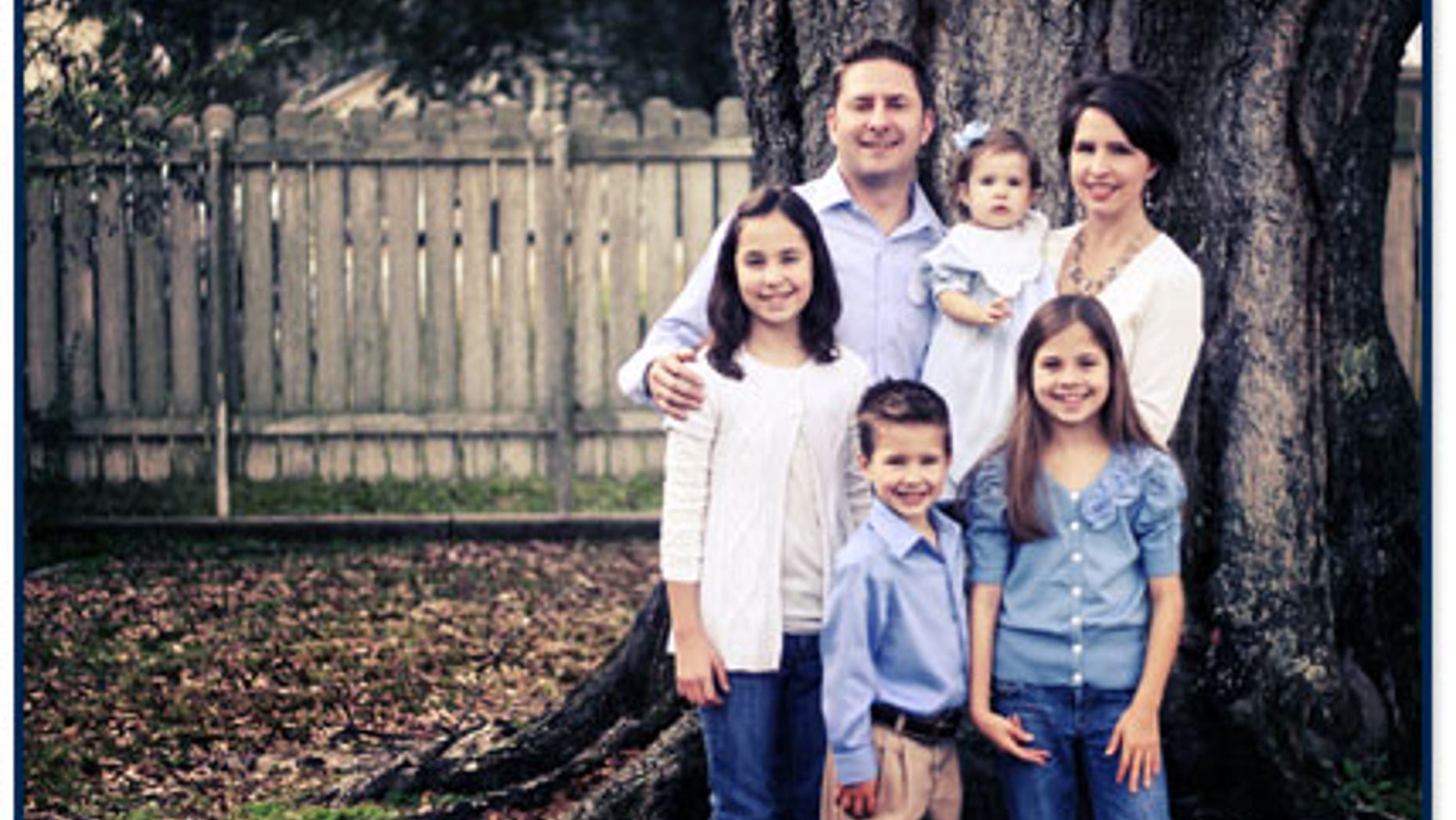 Unofficial election returns show that Republican Jonathan Perry, shown here with his family, has narrowly defeated Democrat Nathan Granger in the race to fill a vacant state Senate seat, possibly giving the GOP control of the Senate.