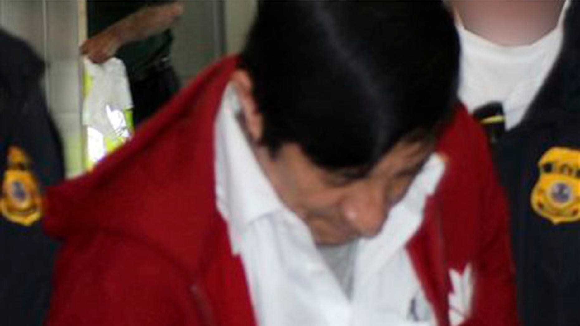 Jorge Sosa, a former Guatemalan soldier, as he is extradited to the U.S. from Canada on Sept. 21, 2012.