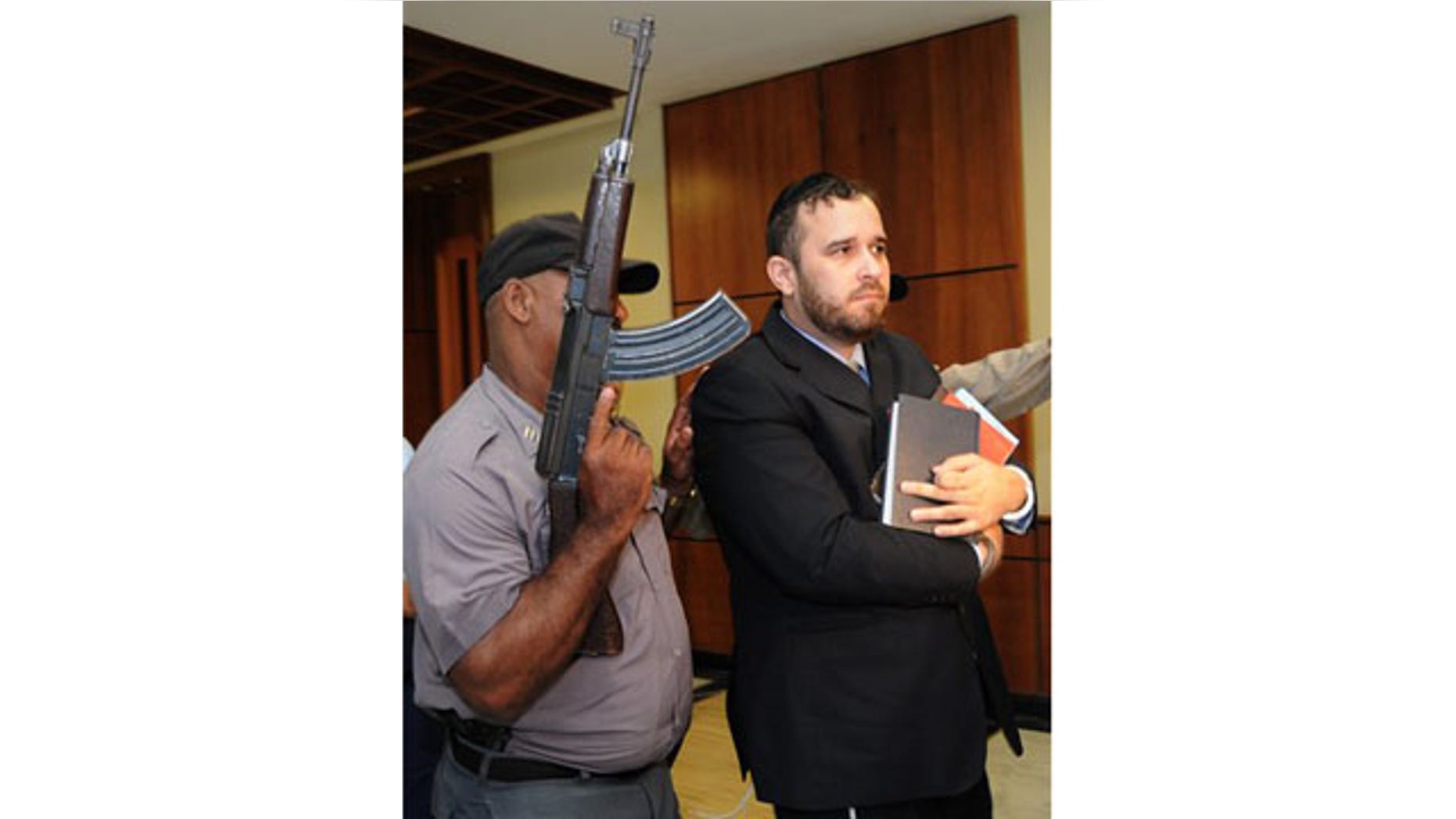 April 2010: Jorge Torres is escorted to the Supreme Court for a hearing regarding a U.S. request for his extradition related to human trafficking charges in Santo Domingo.