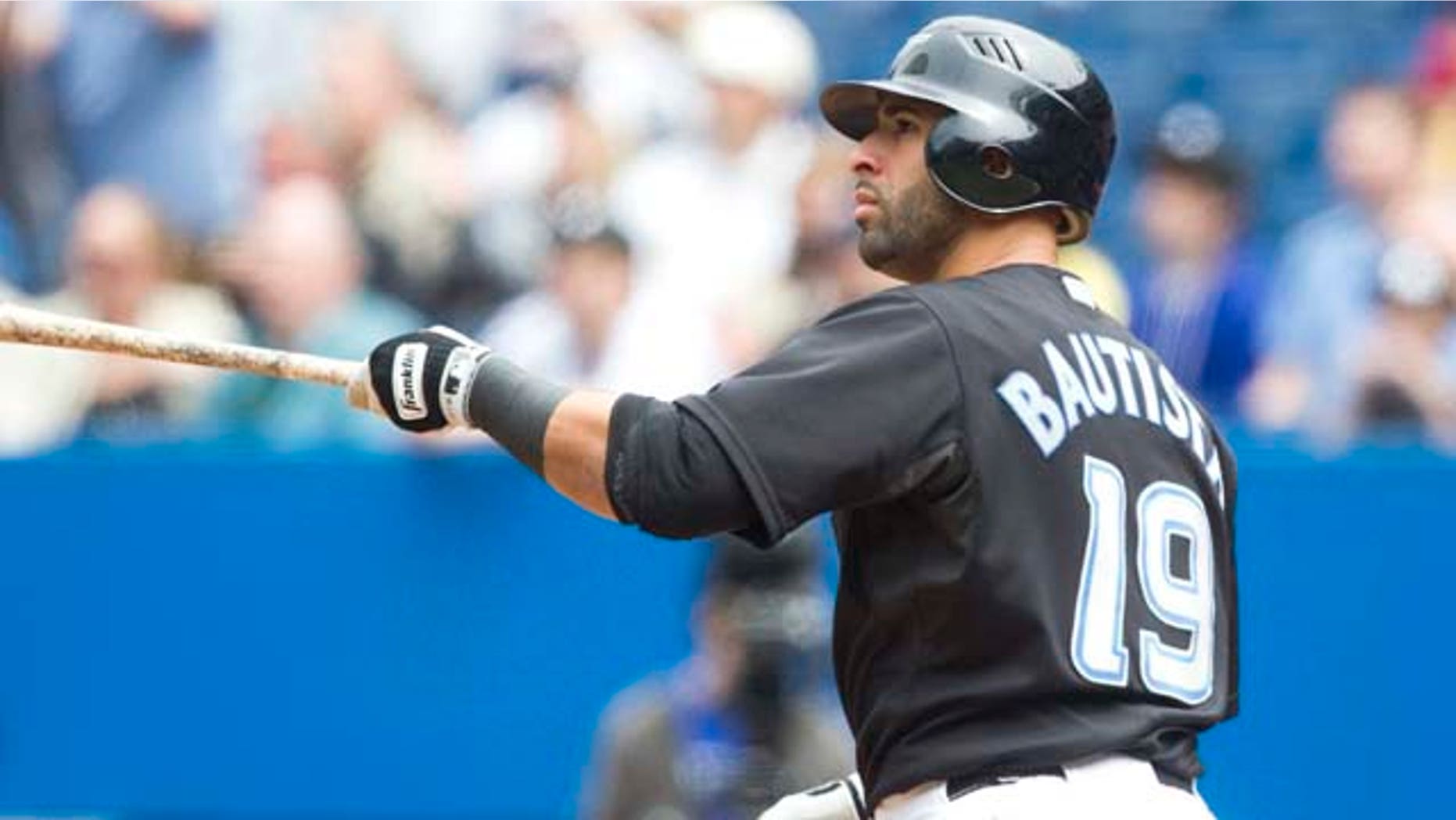 Toronto Blue Jays' Jose Bautista watches his three-run home run hit during the first inning of a baseball game, Saturday, May 28, 2011, in Toronto. (AP Photo/The Canadian Press, Darren Calabrese)