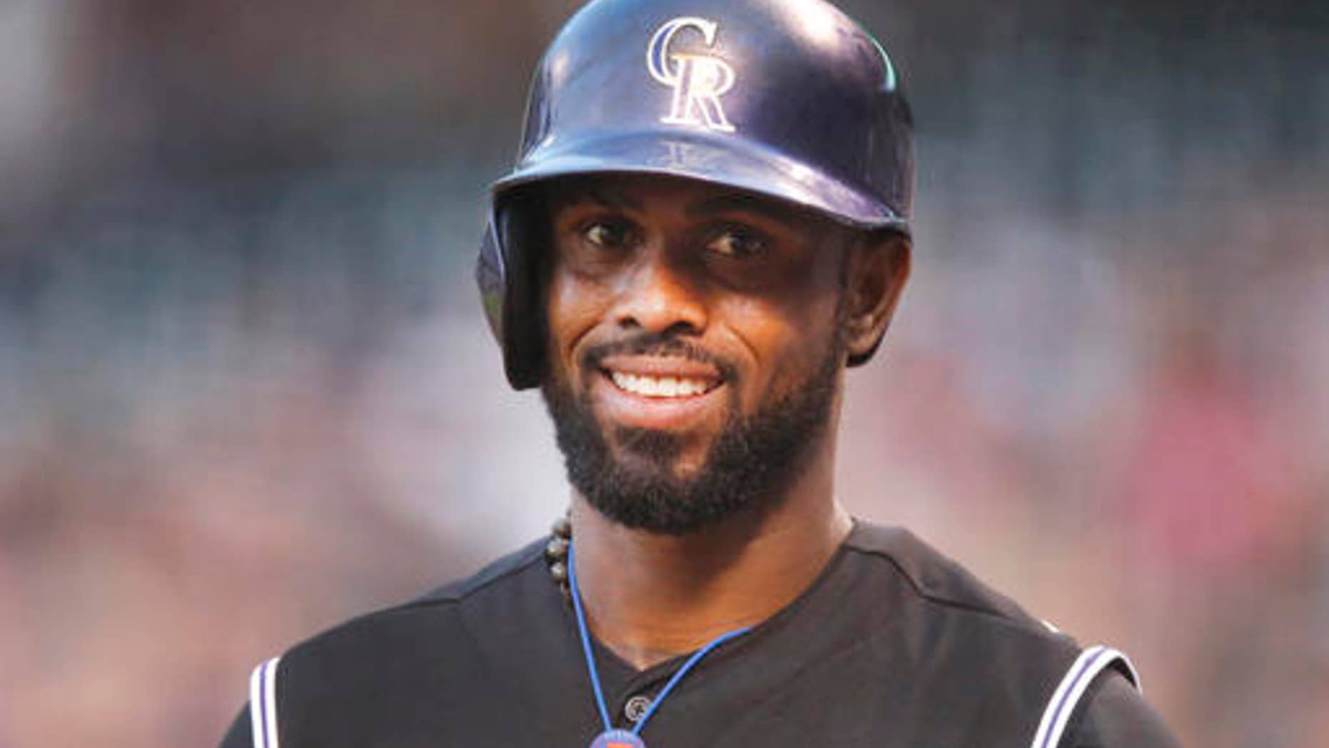 FILE - In this Aug. 21, 2015, file photo, Colorado Rockies shortstop Jose Reyes is seen in the first inning of a baseball game in Denver. Colorados Jose Reyes has been suspended by Major League Baseball through May 31 for violating MLBs domestic violence policy. The unpaid suspension of Reyes is retroactive to February 23, 2016, when Reyes was placed on leave pending the resolution of criminal proceedings in Hawaii. Reyes has agreed not to appeal the discipline. (AP Photo/David Zalubowski, File)