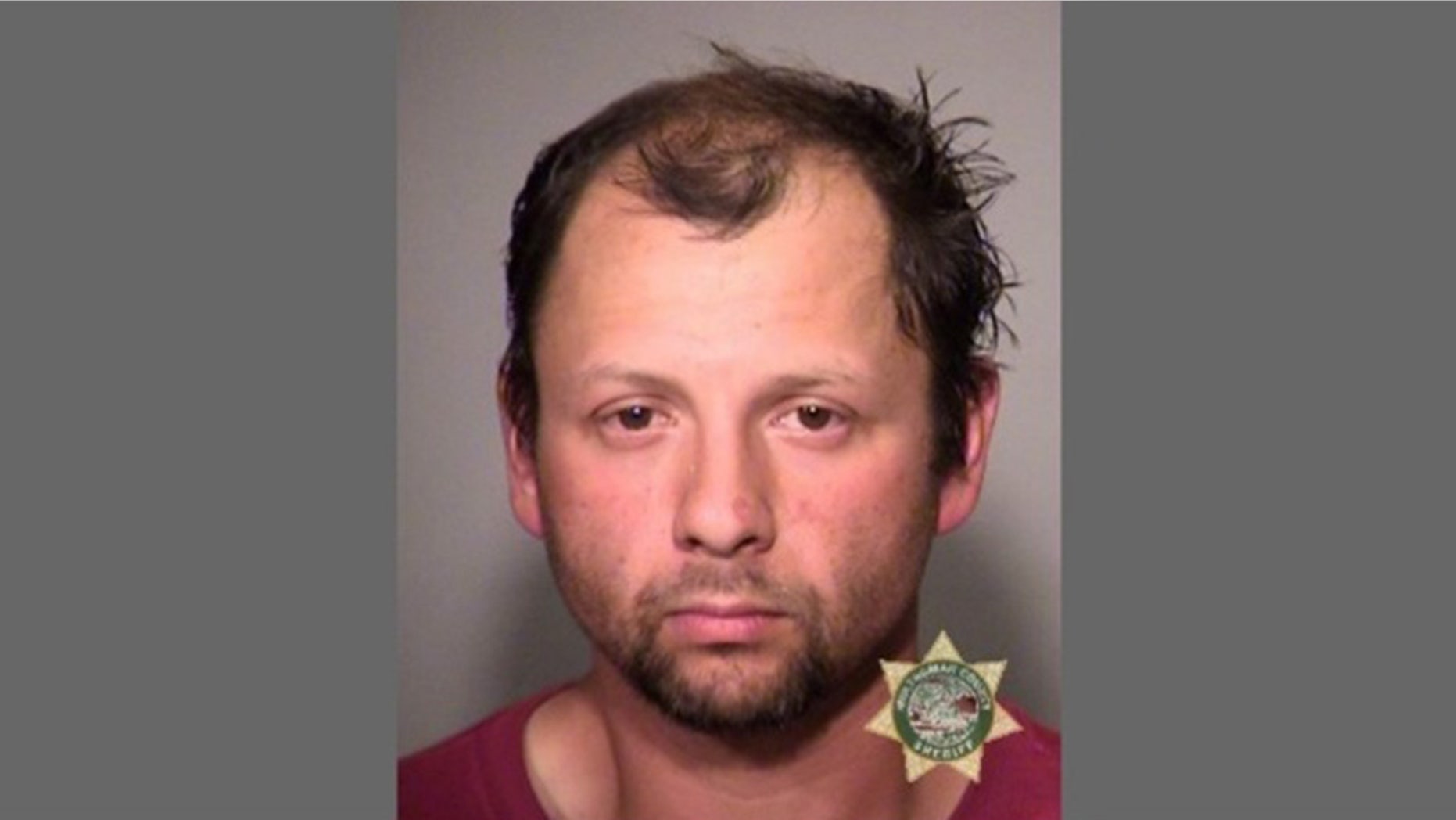 A man was arrested for assault charges after he claims he went to Taco Bell to apply for a job.