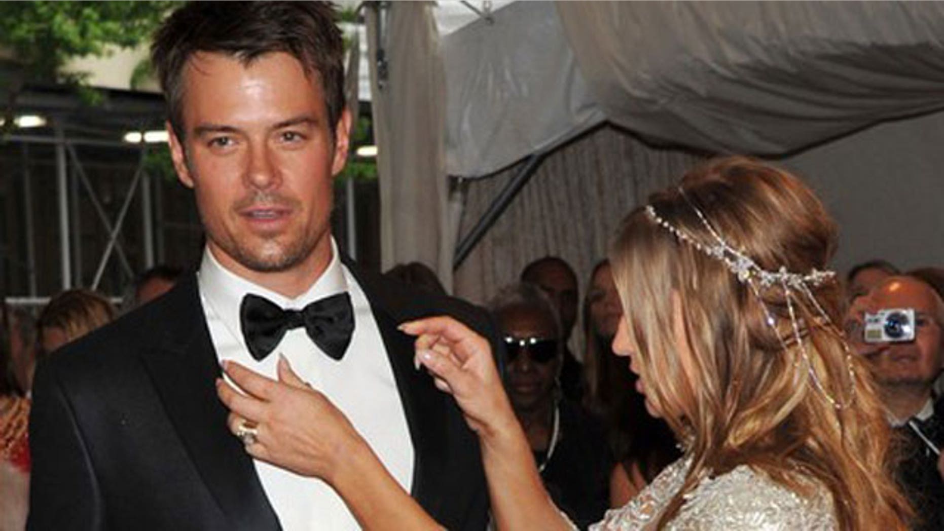 Josh Duhamel (shown here with wife Fergie) urged his fans via twitter to raise awareness of his flooded hometown of Minot, North Dakota.