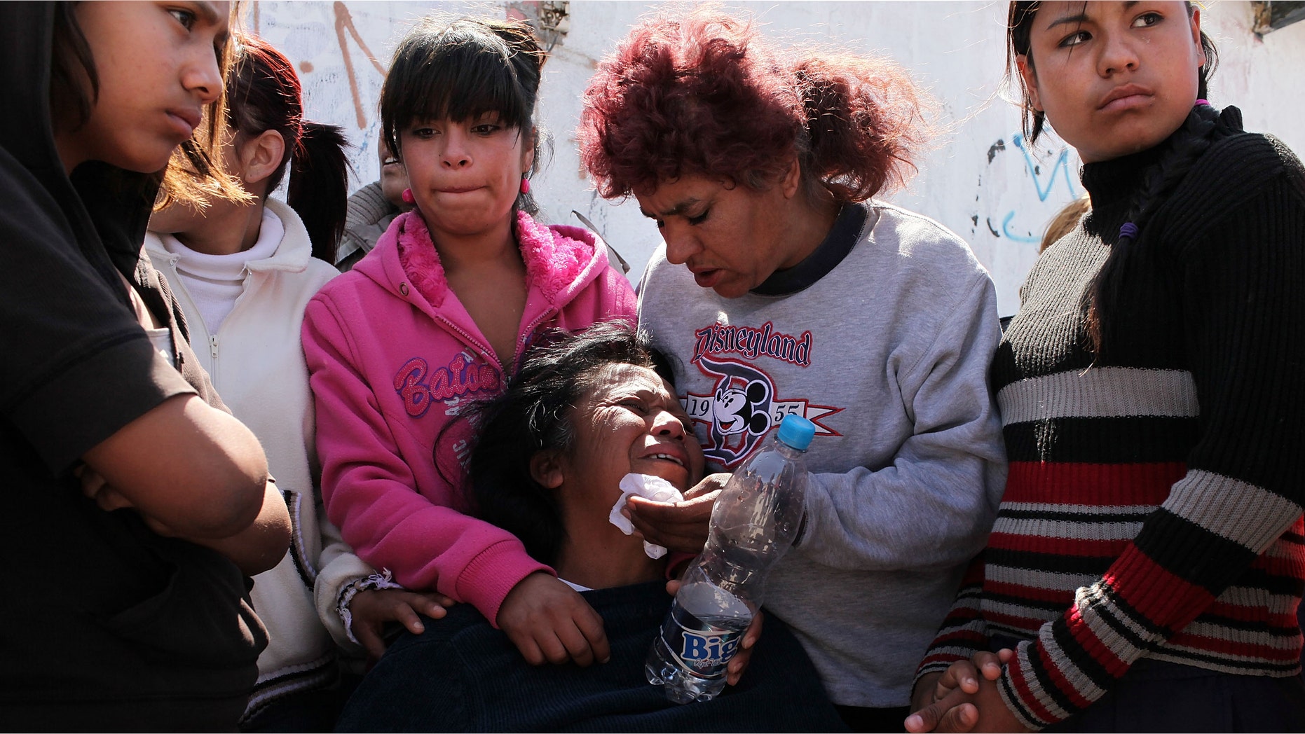 JUAREZ, MEXICO - MARCH 24: Jesusita Cardoza grieves at the scene of the murder of her two daughters aged 17 and 21 March 24, 2010 in Juarez, Mexico. Secretary of State Hillary Rodham Clinton, Defense Secretary Robert Gates, and Homeland Security Secretary Janet Napolitano all visited Mexico on yesterday for discussions centered on Mexico's endemic drug-related violence. The border city of Juarez, Mexico has been racked by violent drug-related crime recently and has quickly become one of the most dangerous cities in the world in which to live. As drug cartels have been fighting over ever-lucrative drug corridors along the United States border, the murder rate in Juarez has risen to 173 slayings for every 100,000 residents. President Felipe Calderon's strategy of sending 7000 troops to Juarez has not mitigated the situation. With a population of 1.3 million, 2,600 people died in drug-related violence last year and 500 so far this year, including two Americans recently who worked for the U.S. Consulate and were killed as they returned from a child's party. (Photo by Spencer Platt/Getty Images)