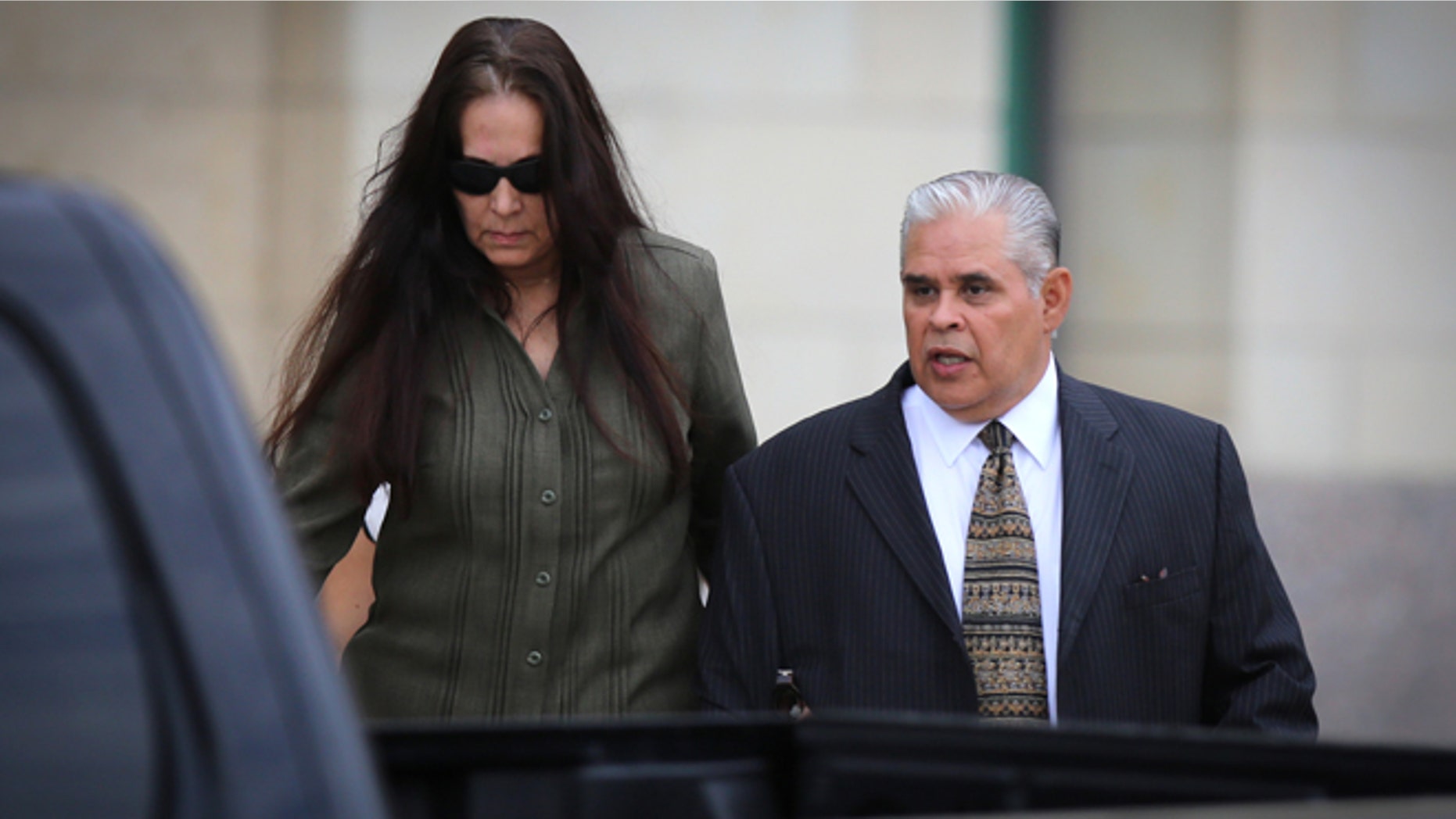 Aug 21, 2013: Former 404th state District Judge Abel Limas, right, quickly exits the federal courthouse in Brownsville, Texas.