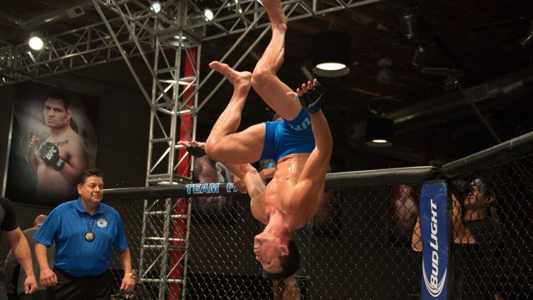 LAS VEGAS, NV - AUGUST 05: Julian Erosa celebrates his victory over Mehdi Baghdad during the filming of The Ultimate Fighter: Team McGregor vs Team Faber at the UFC TUF Gym on August 5, 2015 in Las Vegas, Nevada. (Photo by Brandon Magnus/Zuffa LLC/Zuffa LLC via Getty Images)