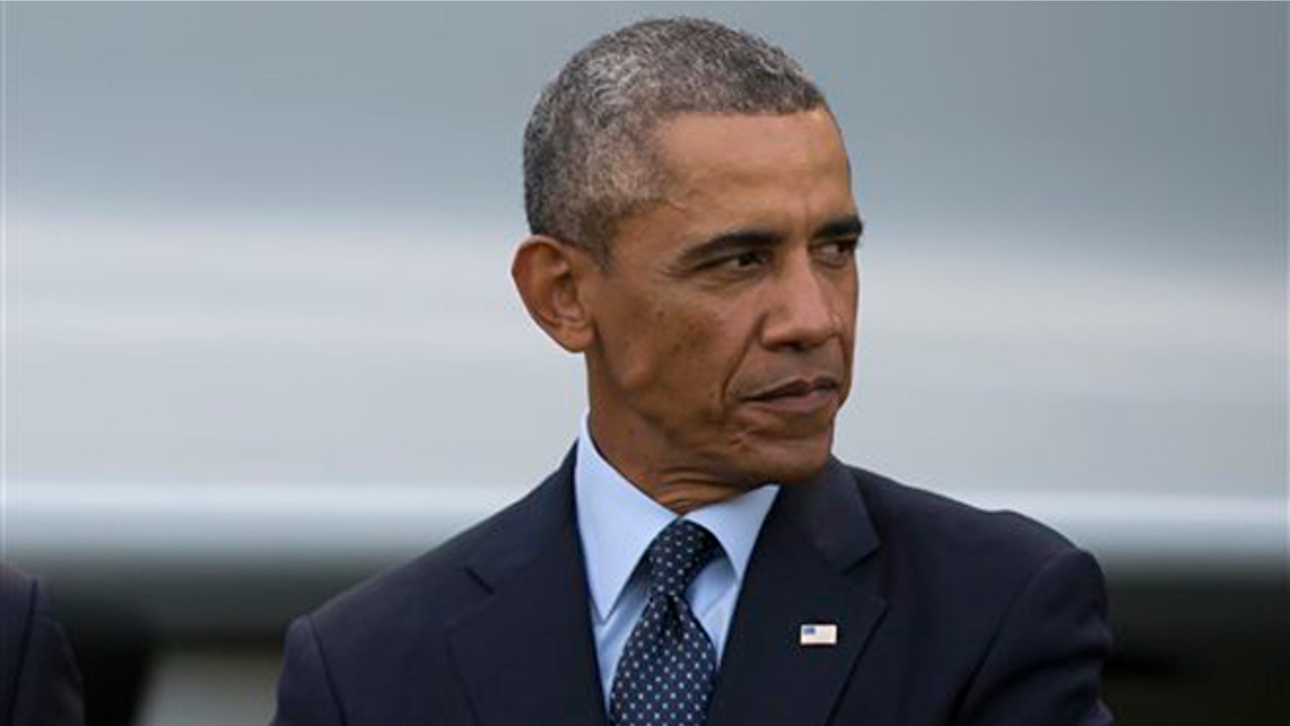 FILE - In this Sept. 5, 2014, file photo U.S. President Barack Obama looks around during a flypast at the NATO summit in Newport, Wales. Obama will begin this week to lay out a strategy to defeat Islamic State militants in the Middle East, starting with a White House meeting with bipartisan congressional leaders on Tuesday, Sept. 9, 2014 and a speech on Wednesday, the eve of the 13th anniversary of the deadliest terrorist attack on U.S. soil. (AP Photo/Jon Super, File)