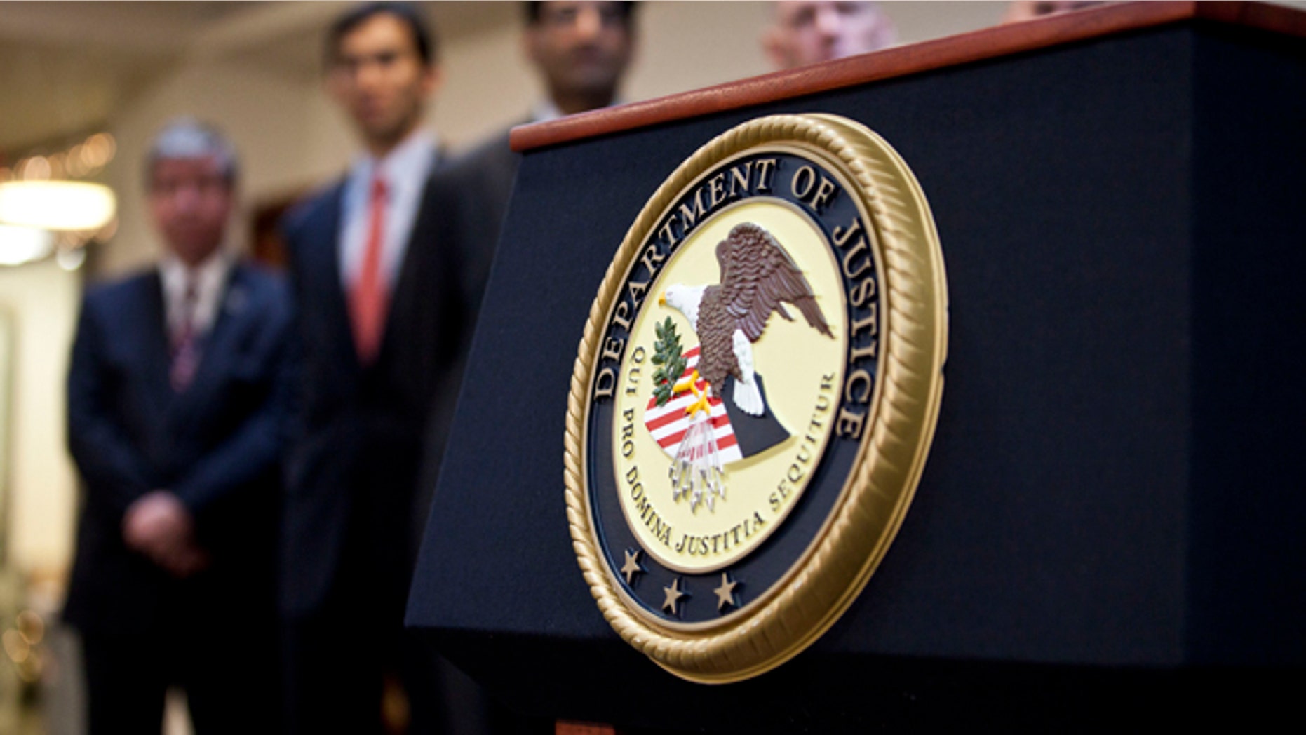 NEW YORK, NY - DECEMBER 11: A US Department of Justice seal is displayed on a podium during a news conference to announce money laundering charges against HSBC on December 11, 2012 in the Brooklyn borough of New York City. HSBC Holdings plc and HSBC USA NA have agreed to pay $1.92 billion and enter into a deferred prosecution agreement with the U.S. Department of Justice in regards to charges involving money laundering with Mexican drug cartels. (Photo by Ramin Talaie/Getty Images)