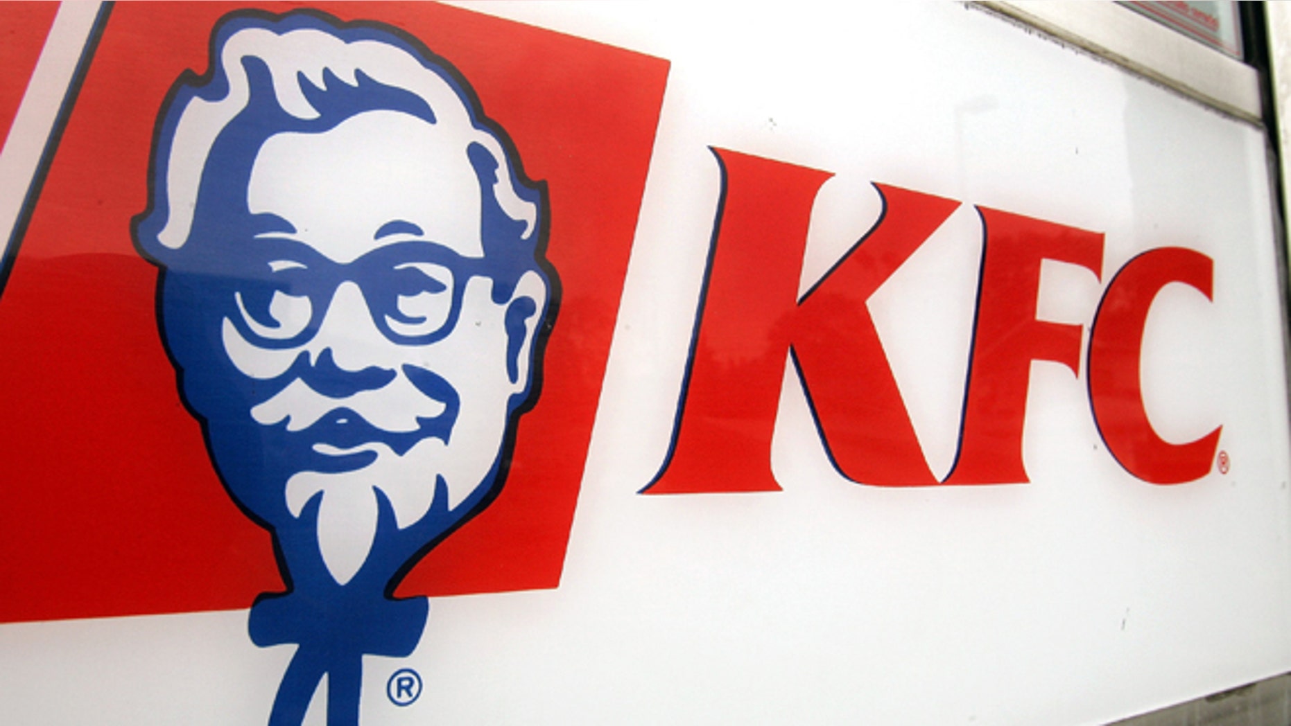 CHICAGO - AUGUST 15: KFC signage is visible on a door of a cigarette-smoke-free company-owned KFC restaurant August 15, 2005 in Chicago, Illinois. Louisville, Kentucky-based Yum! Brands' company-owned 1,200 KFC and 1,675 Pizza Hut restaurants starting this week will be enacting a no smoking policy, placing "No Smoking" signs in their US restaurants owned by the company. The company is encouraging their other 4,200 KFC and 4,600 Pizza Hut franchised restaurants in the US to follow. (Photo by Tim Boyle/Getty Images)
