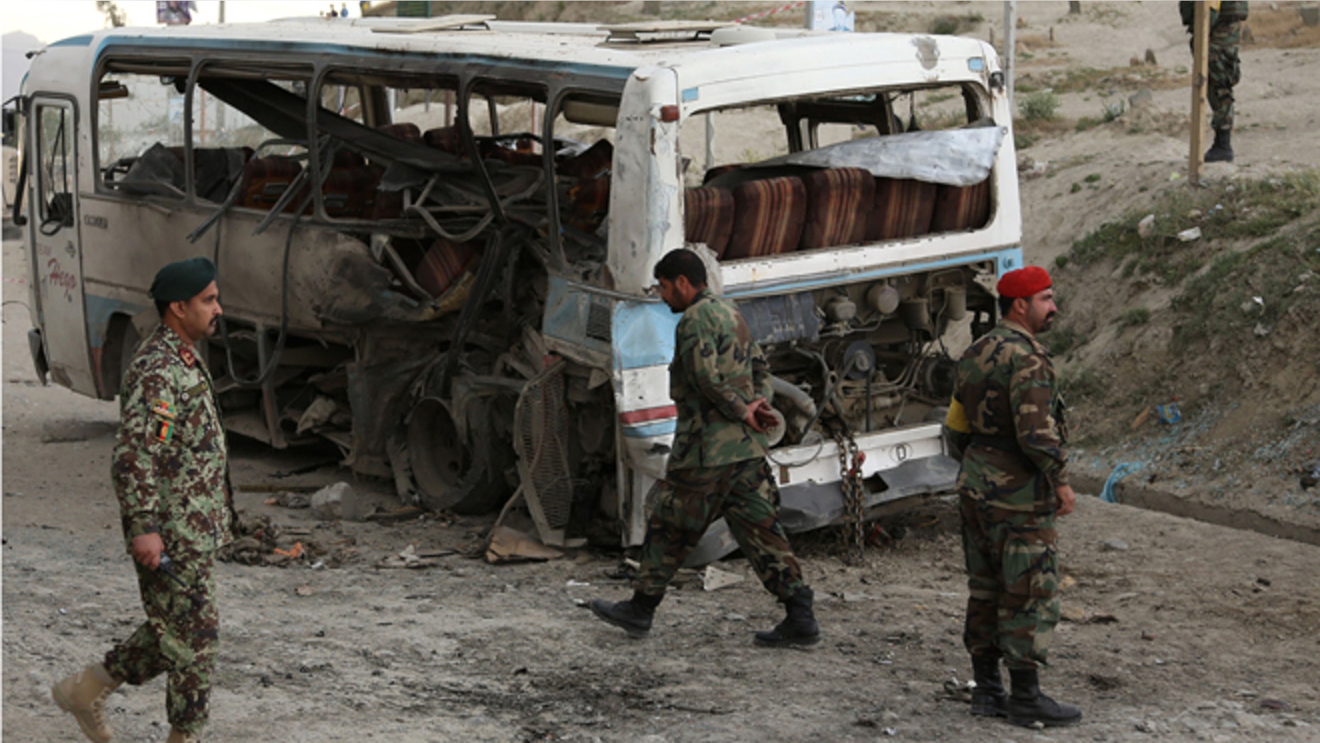 May 26, 2014: Afghan National army soldiers arrive to the scene after suicide attack in Kabul, Afghanistan. (AP)