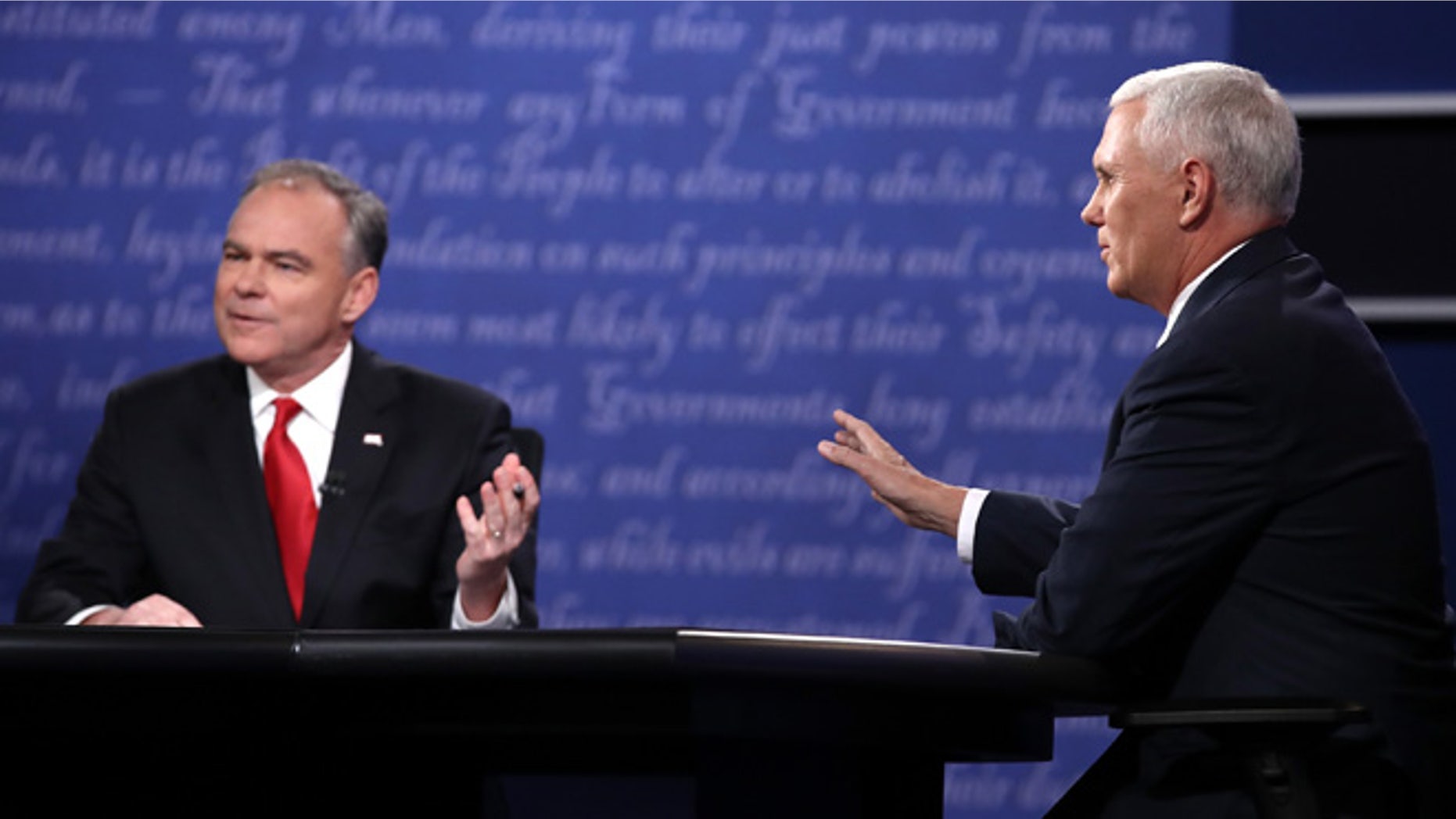 Democratic vice presidential nominee Tim Kaine (L) and Republican vice presidential nominee Mike Pence (R) speak during the Vice Presidential Debate at Longwood University on October 4, 2016 in Farmville, Virginia. This is the second of four debates during the presidential election season and the only debate between the vice presidential candidates. (Photo by Win McNamee/Getty Images)