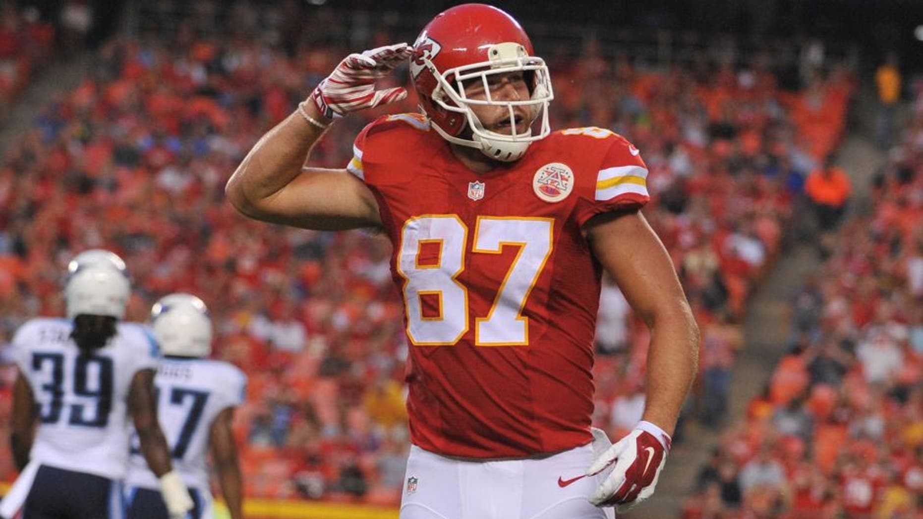 Aug 28, 2015; Kansas City, MO, USA; Kansas City Chiefs tight end Travis Kelce (87) celebrates after a run during the first half against the Tennessee Titans at Arrowhead Stadium. The Chiefs won 34-10. Mandatory Credit: Denny Medley-USA TODAY Sports