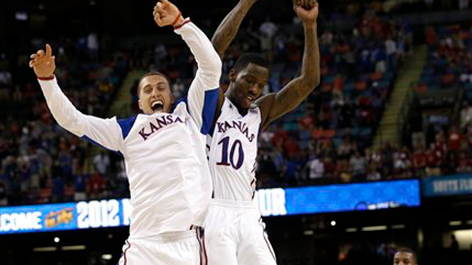 Mar. 31, 2012: Kansas guard Tyshawn Taylor (10) celebrates with Kansas guard Christian Garrett at the end of an NCAA Final Four semifinal college basketball tournament game against Ohio State.