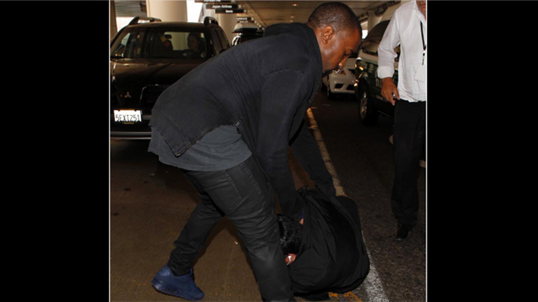 July 19, 2013: Kanye West Attacks Photographer At LAX