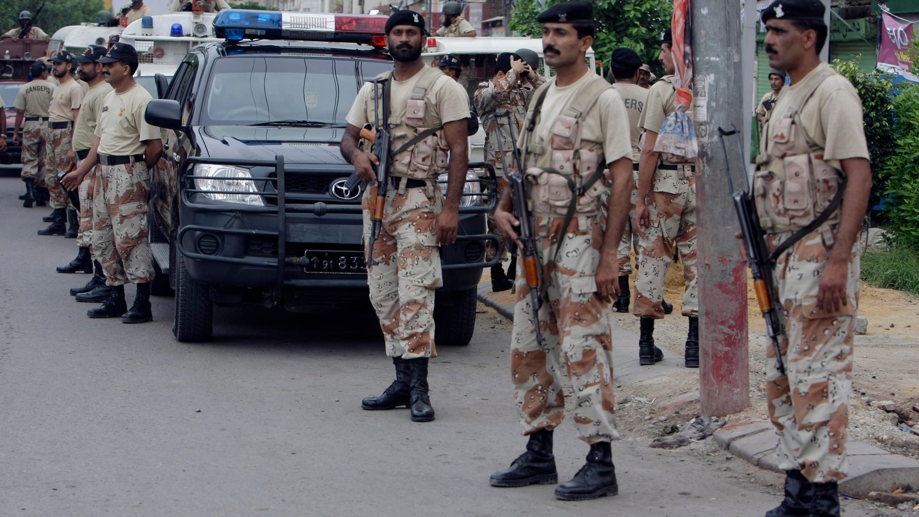 August 24: Pakistani security personnel visit a troubled area during a crackdown operation against target killers and the extortion mafia in Karachi, Pakistan. Over one hundred people lost their lives in the past week in result of a fresh wave of violence which crippled the Pakistan's largest city of Karachi.