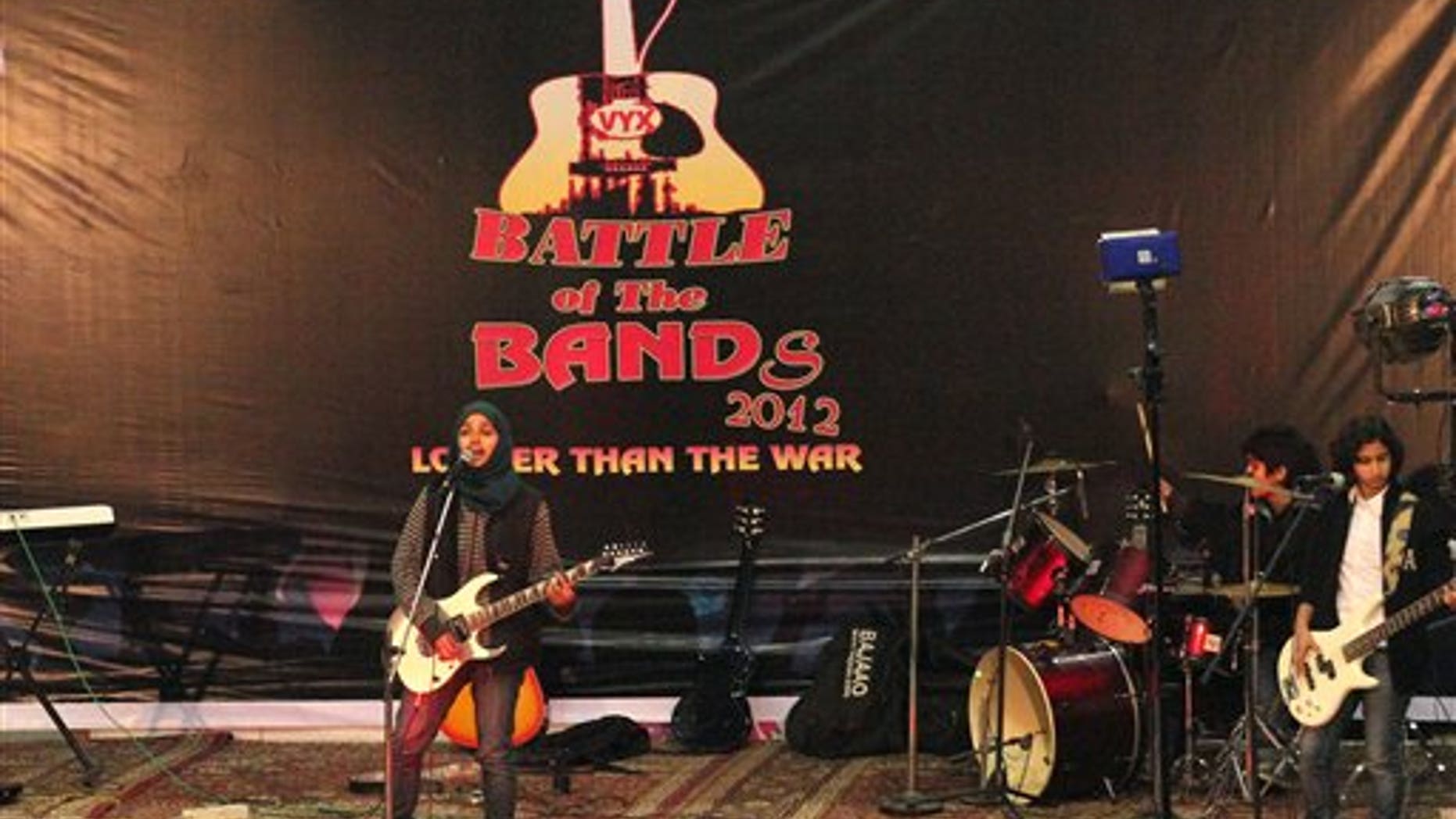 In this Sunday, Dec. 23, 2012 photo, members of Indian-controlled Kashmirs first all-girl rock band Pragaash, or First Light, perform at the annual Battle of the Bands in Srinagar, India.