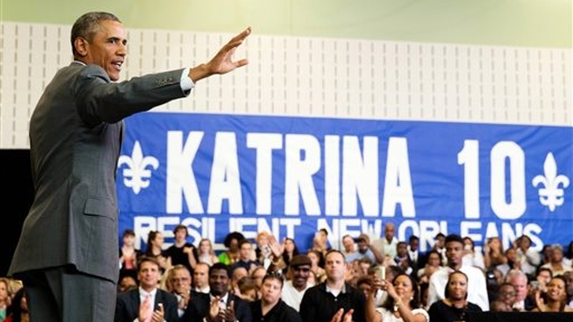 President Barack Obama waves after speaking at an event commemorating the 10th anniversary of Hurricane Katrina in New Orleans, Thursday, Aug. 27, 2015. (AP Photo/Andrew Harnik)