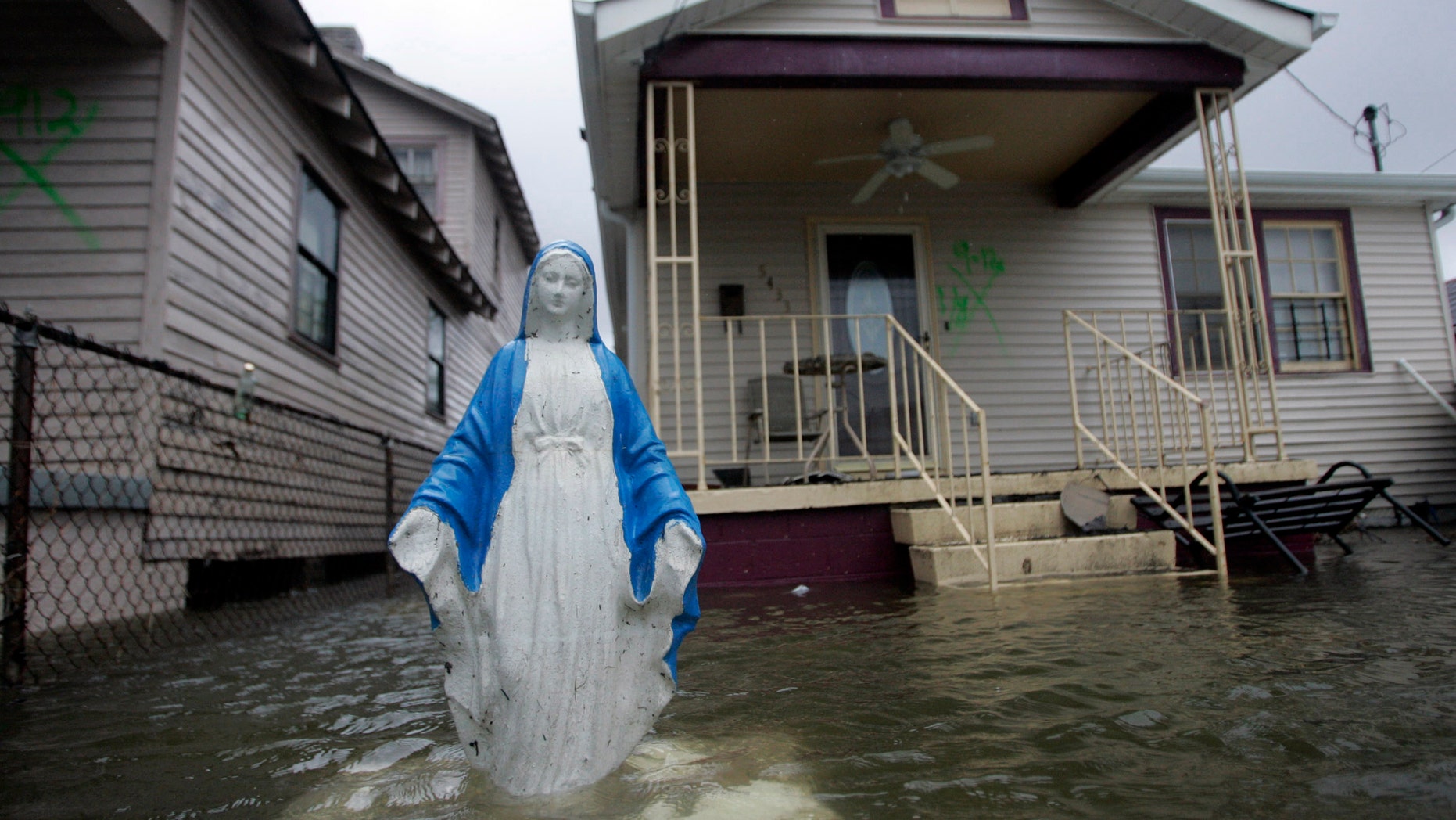 File photo - A statue of the Virgin Mary is seen standing in flood waters in the lower Ninth Ward in New Orleans, Louisiana Sept. 23, 2005.