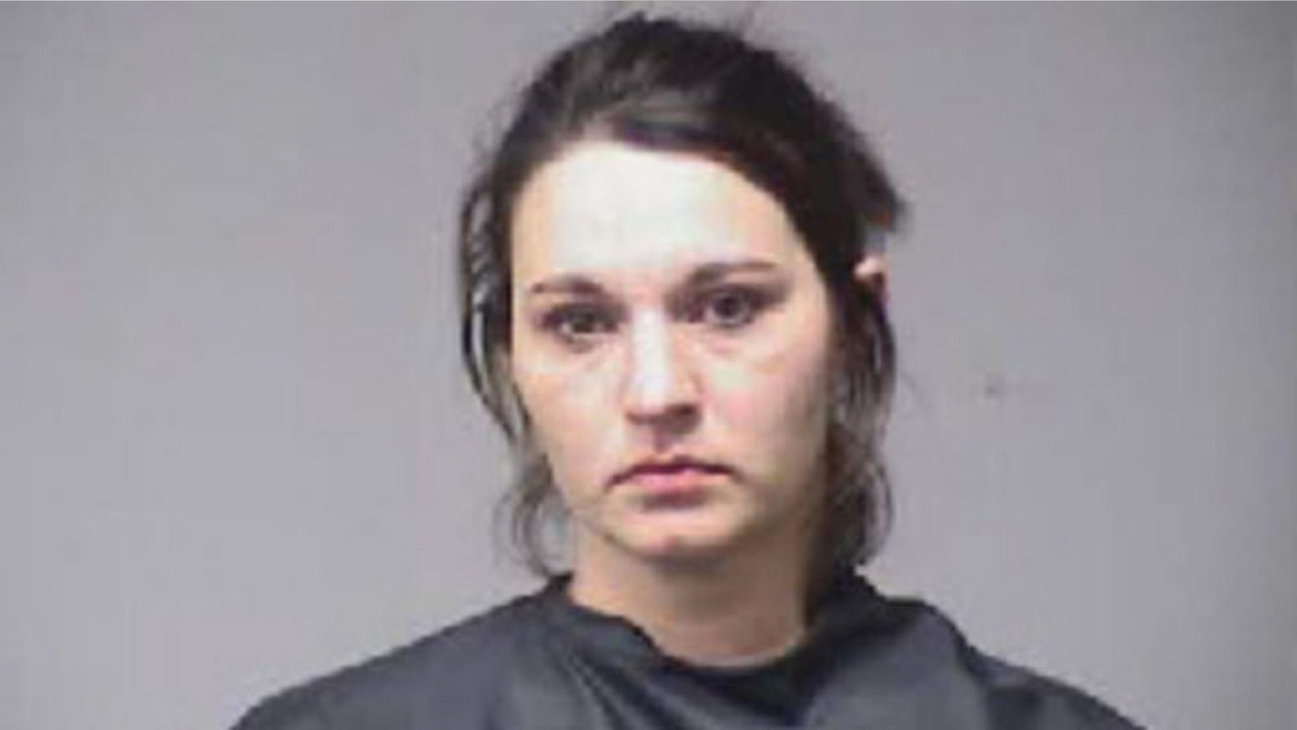 This mugshot shows Kayla Finely who faces charges over a move she rented and failed to return nine years ago.