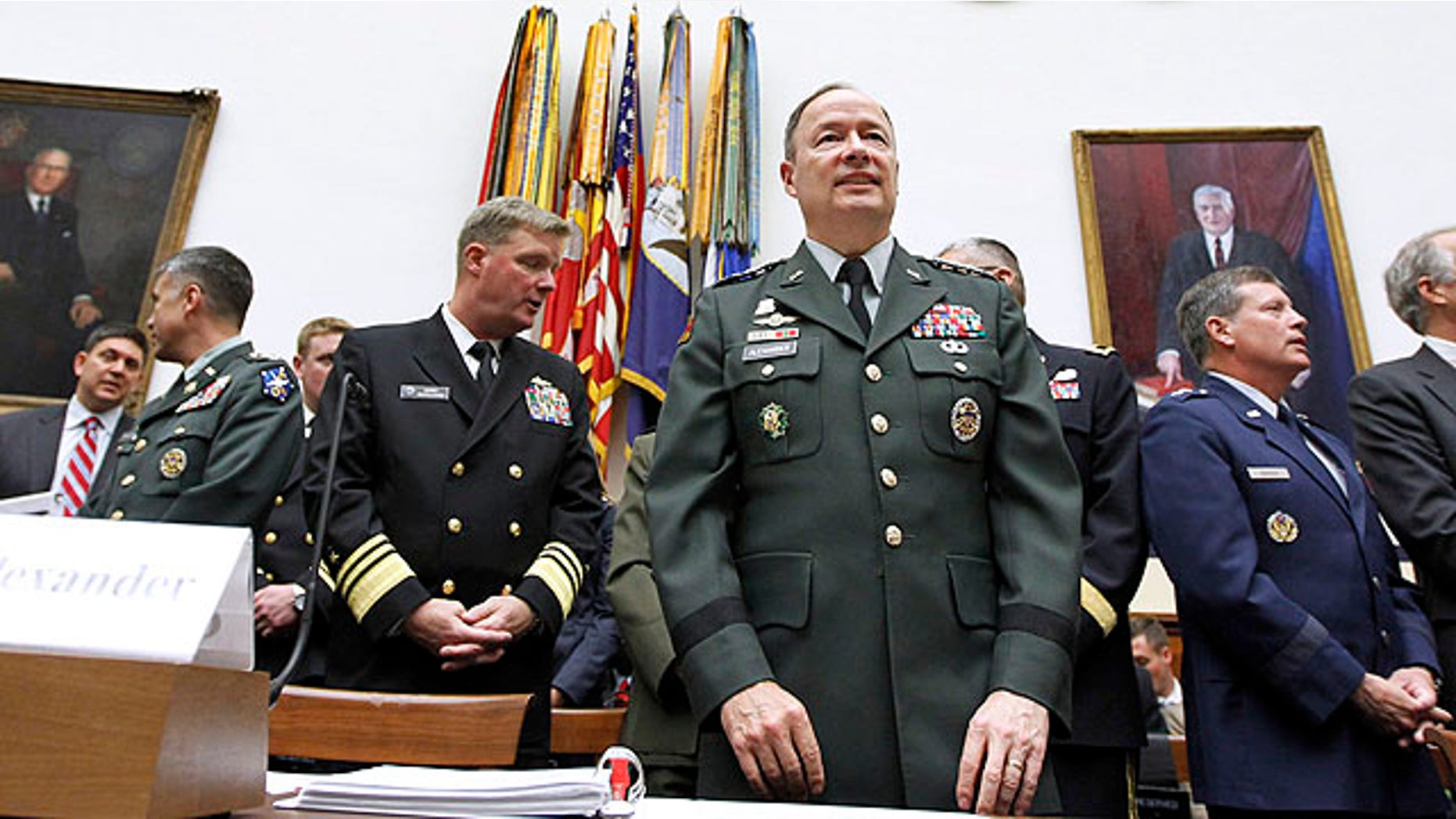 Sept. 23, 2010: Army Gen. Keith B. Alexander, commander of the U.S. Cyber Command, center, arrives on Capitol Hill in Washington to testify before the House Armed Services Committee hearing on cyberspace operations.