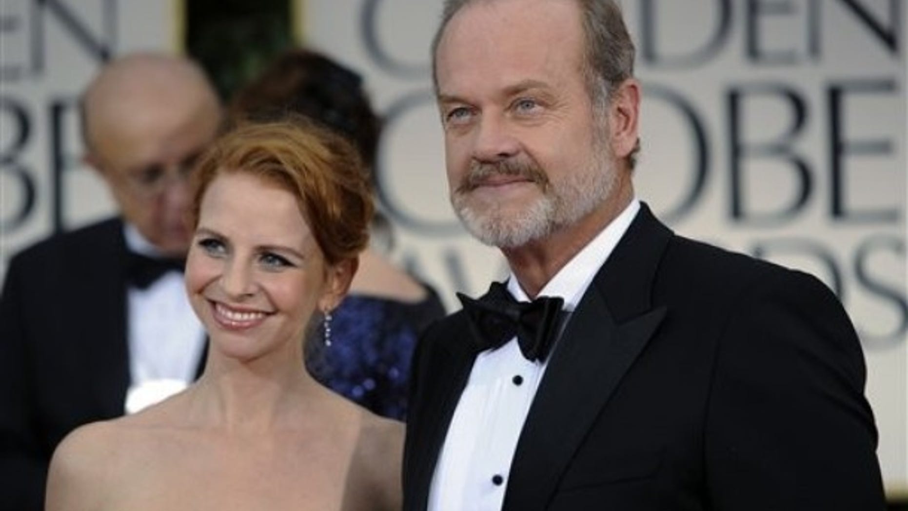 Kelsey Grammer and his wife Kayte Walsh arrive at the 69th Annual Golden Globe Awards Sunday, Jan. 15, 2012, in Los Angeles. (AP Photo/Chris Pizzello)