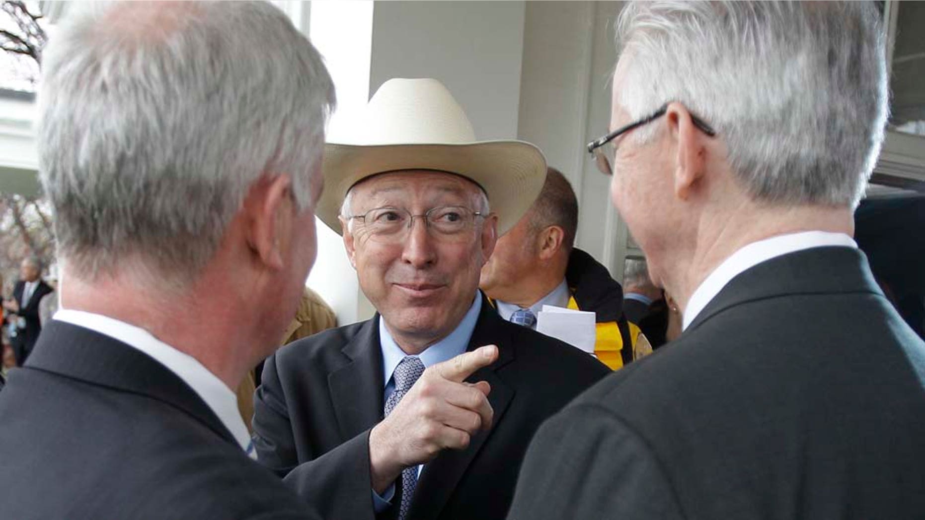 U.S. Interior Secretary Kenneth Salazar gestures after a news conference in Boston, Tuesday, April 19, 2011. A federal agency approved a construction and operations plan for the Cape Wind project off the Massachusetts coast, clearing the way for work to begin on America's first offshore wind farm as early as this fall, which was announced by Salazar. At left is Massachusetts Secretary of Energy and Environmental Affairs Richard Sullivan, and at right is Cape Wind Associates Vice President Dennis Duffy. (AP Photo/Charles Krupa)